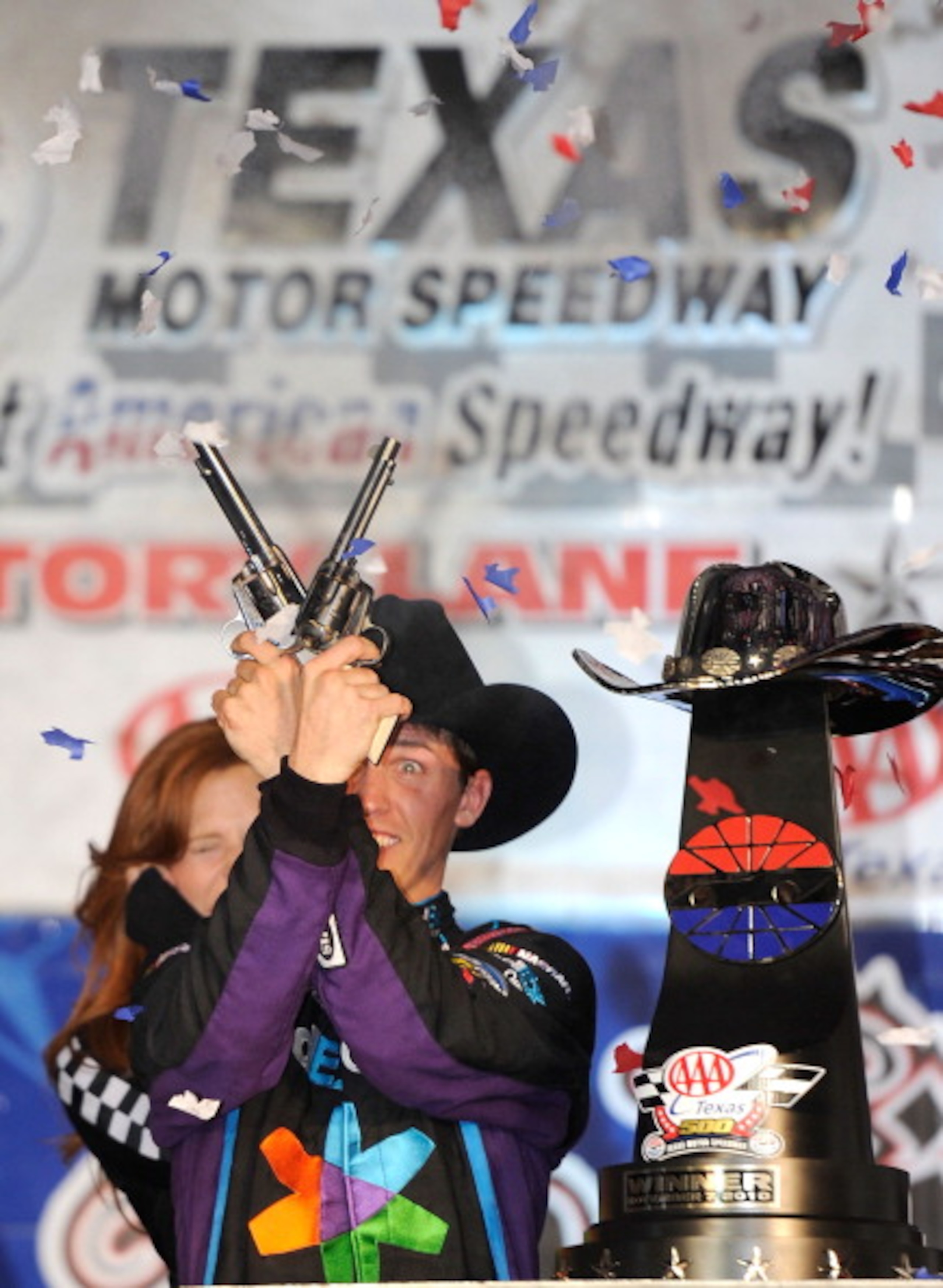 FORT WORTH, TX - NOVEMBER 07:   Denny Hamlin, driver of the #11 FedEx Office Toyota, shoots a Turnbull Revolvers in Victory Lane after winning the NASCAR Sprint Cup Series AAA Texas 500 at Texas Motor Speedway on November 7, 2010 in Fort Worth, Texas.  (P