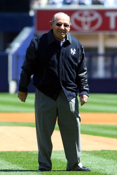 NEW YORK - APRIL 16:  Yogi Berra smiles after throwing the ceremonial first pitch before the opening day game between the Cleveland Indians and the New York Yankees at the new Yankee Stadium on April 16, 2009 in the Bronx borough of New York City. This is
