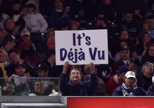 NEW YORK - OCTOBER 29:  A fan of the New York Yankees holds up a sign which reads 'It's Deja Vu' in reference to Hall of Famer Yogi Berra against the Philadelphia Phillies in Game Two of the 2009 MLB World Series at Yankee Stadium on October 29, 2009 in t