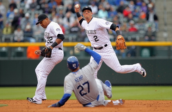 DENVER, CO - APRIL 06:  Shortstop Troy Tulowitzki #2 of the Colorado Rockies turns a double play over Matt Kemp #27 of the Los Angeles Dodgers after he fielded a ground ball by James Loney #7 of the Los Angeles Dodgers as second baseman Jose Lopez #22 of