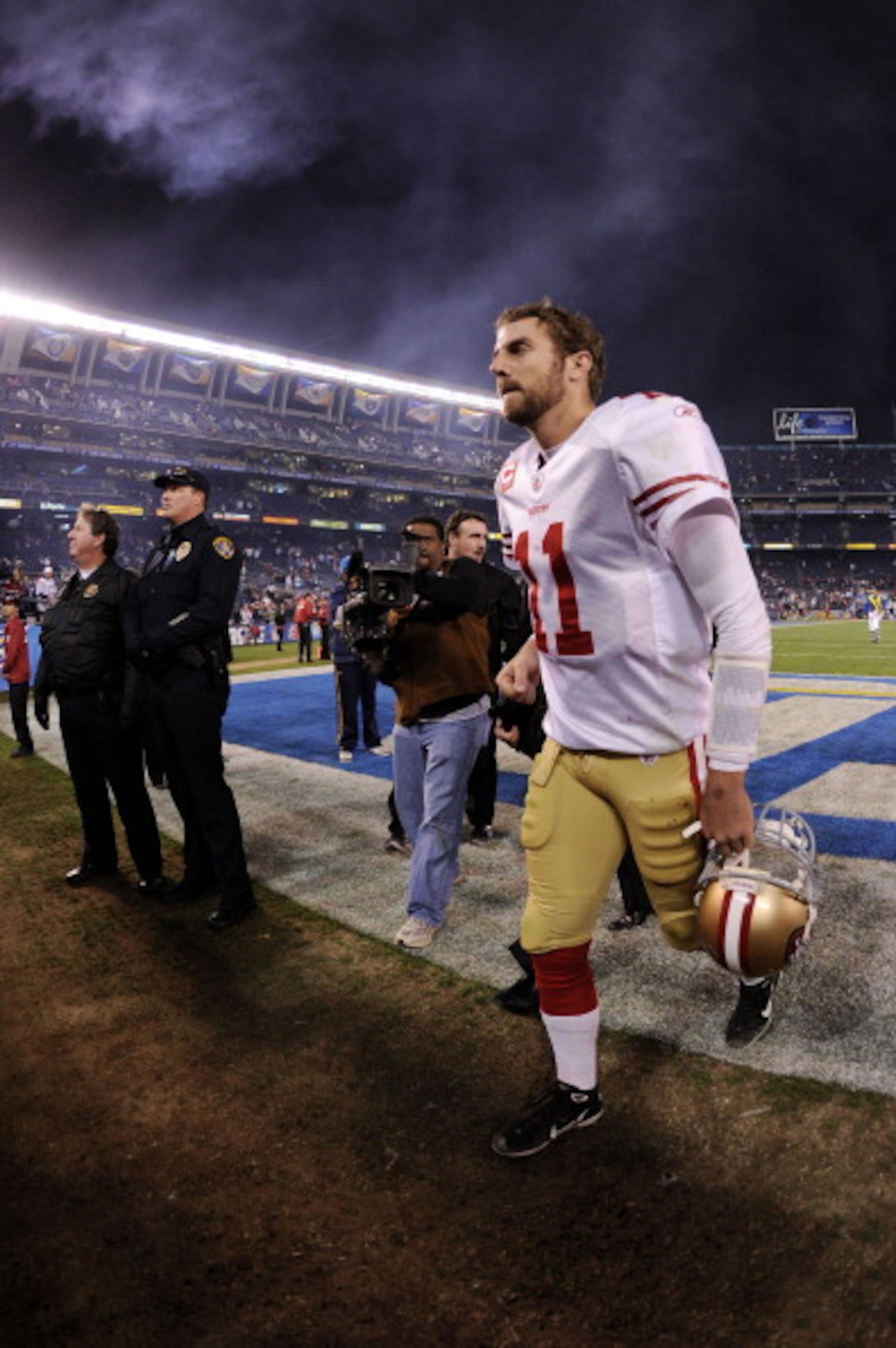 SAN DIEGO, CA - DECEMBER 16:  Quarterback Alex Smith #11 of the San Francisco 49ers jogs off the field after losing to the San Diego Chargers 34-7 at Qualcomm Stadium on December 16, 2010 in San Diego, California.  (Photo by Harry How/Getty Images)