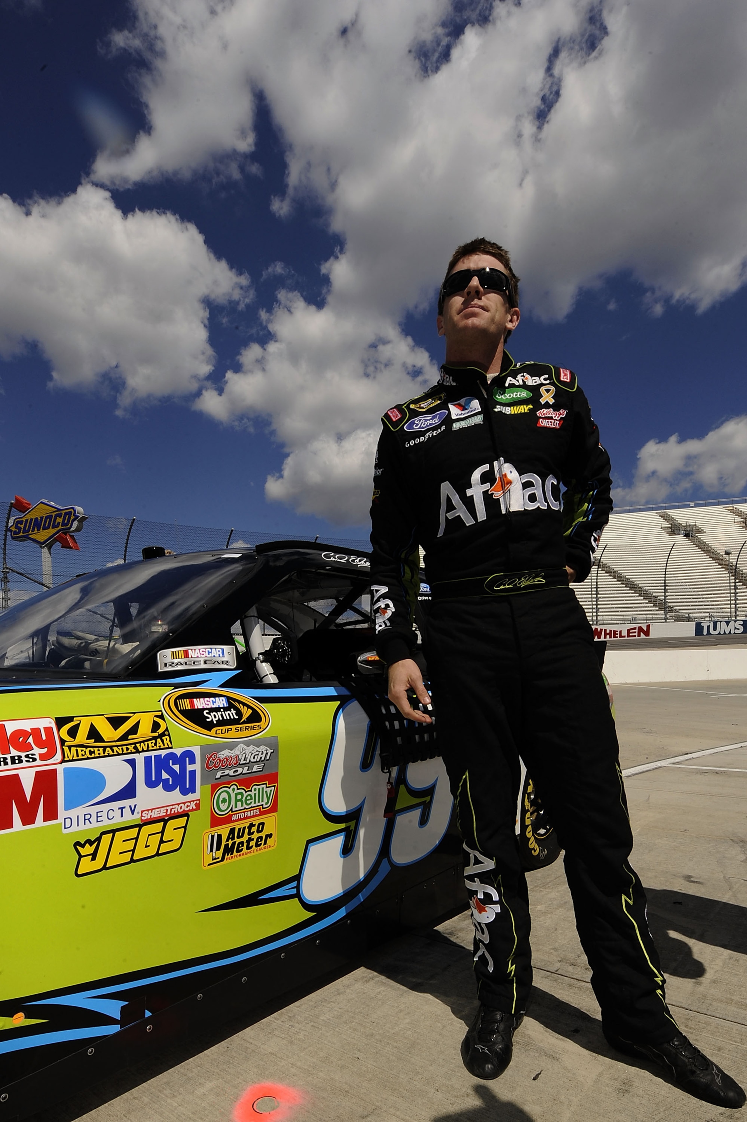MARTINSVILLE, VA - APRIL 02:  Carl Edwards, driver of the #99 Aflac Ford, stands on the grid during qualifying for the NASCAR Sprint Cup Series Goody's Fast Relief 500 at Martinsville Speedway on April 2, 2011 in Martinsville, Virginia.  (Photo by John Ha