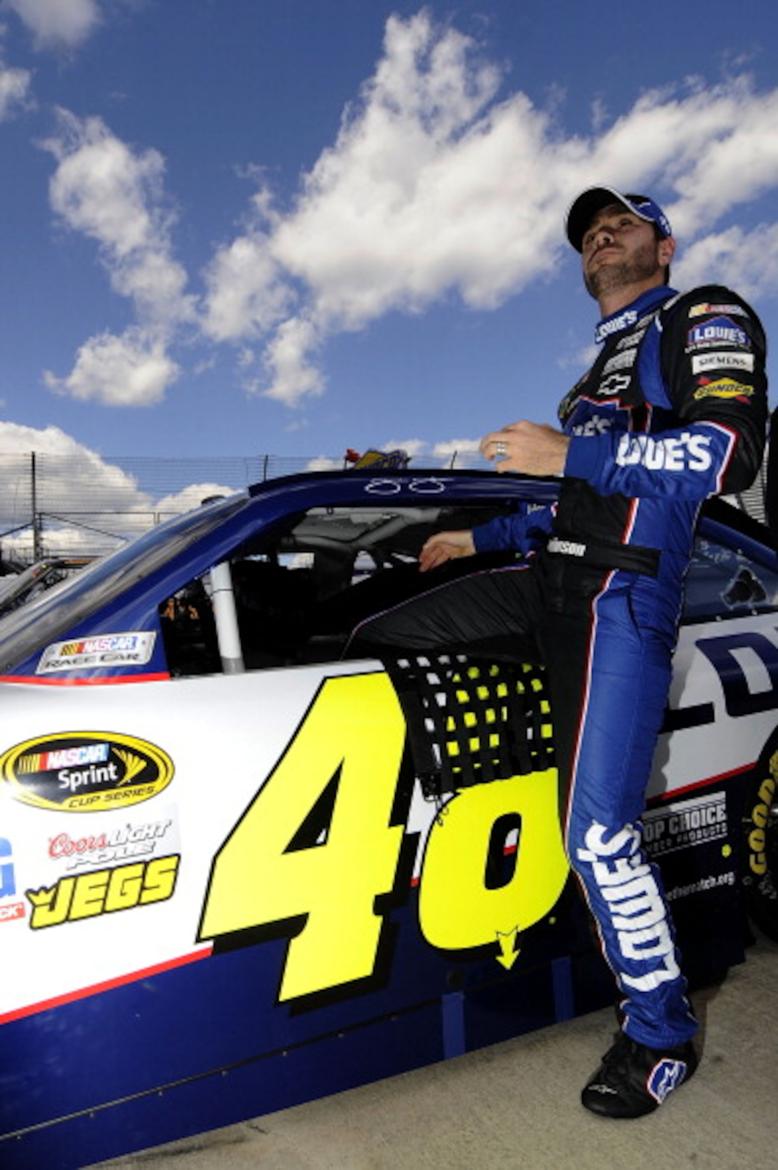 MARTINSVILLE, VA - APRIL 02:  Jimmie Johnson, driver of the #48 Lowe's Chevrolet, climbs out of his car after qualifying for the NASCAR Sprint Cup Series Goody's Fast Relief 500 at Martinsville Speedway on April 2, 2011 in Martinsville, Virginia.  (Photo