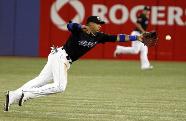 TORONTO, ON - SEPTEMBER 28: Yunel Escobar #5 of the Toronto Blue Jays dives for a line drive against the New York Yankees during an MLB game at the Rogers Centre September 28, 2010 in Toronto, Ontario, Canada. (Photo by Abelimages/Getty Images)