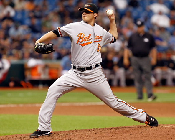 ST PETERSBURG, FL - APRIL 03:   Pitcher Zach Britton #53 of the Baltimore Orioles pitches against the Tampa Bay Rays during the game at Tropicana Field on April 3, 2011 in St. Petersburg, Florida.  (Photo by J. Meric/Getty Images)