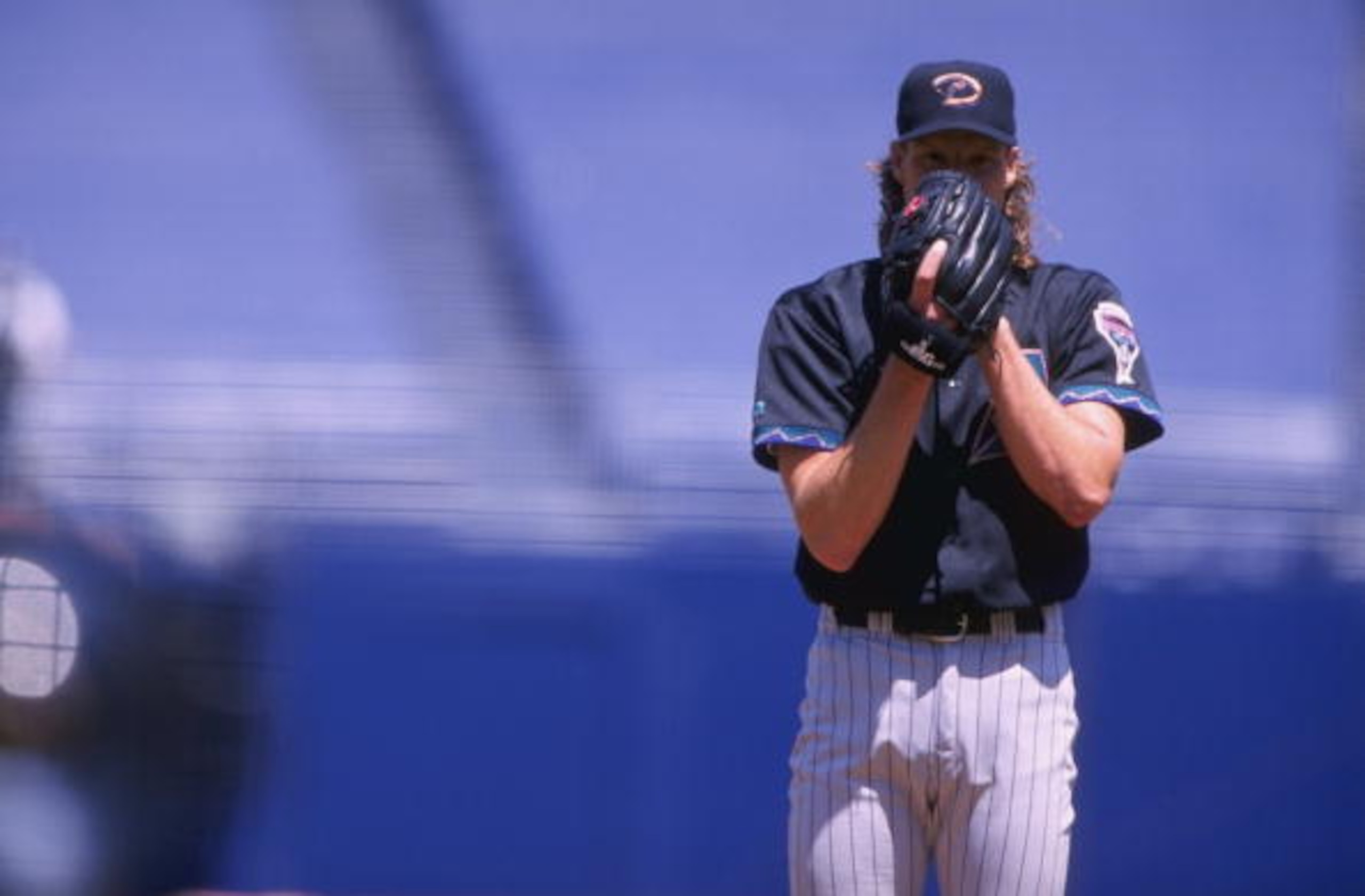 25 Apr 1999:  Pitcher Randy Johnson #51 of the Arizona Diamondbacks gets ready to pitch the ball during the game against the San Diego Padres at Qualcomm Stadium in San Diego, California. The Diamondbacks defeated the Padres 5-3. Mandatory Credit: Todd Wa