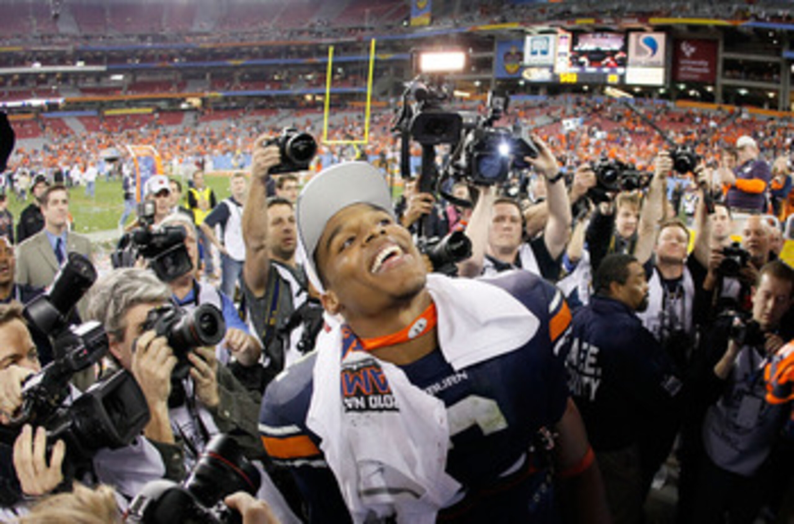 GLENDALE, AZ - JANUARY 10:  Quarterback Cameron Newton #2 of the Auburn Tigers celebrates their 22-19 victory after defeating the Oregon Ducks in the Tostitos BCS National Championship Game at University of Phoenix Stadium on January 10, 2011 in Glendale,
