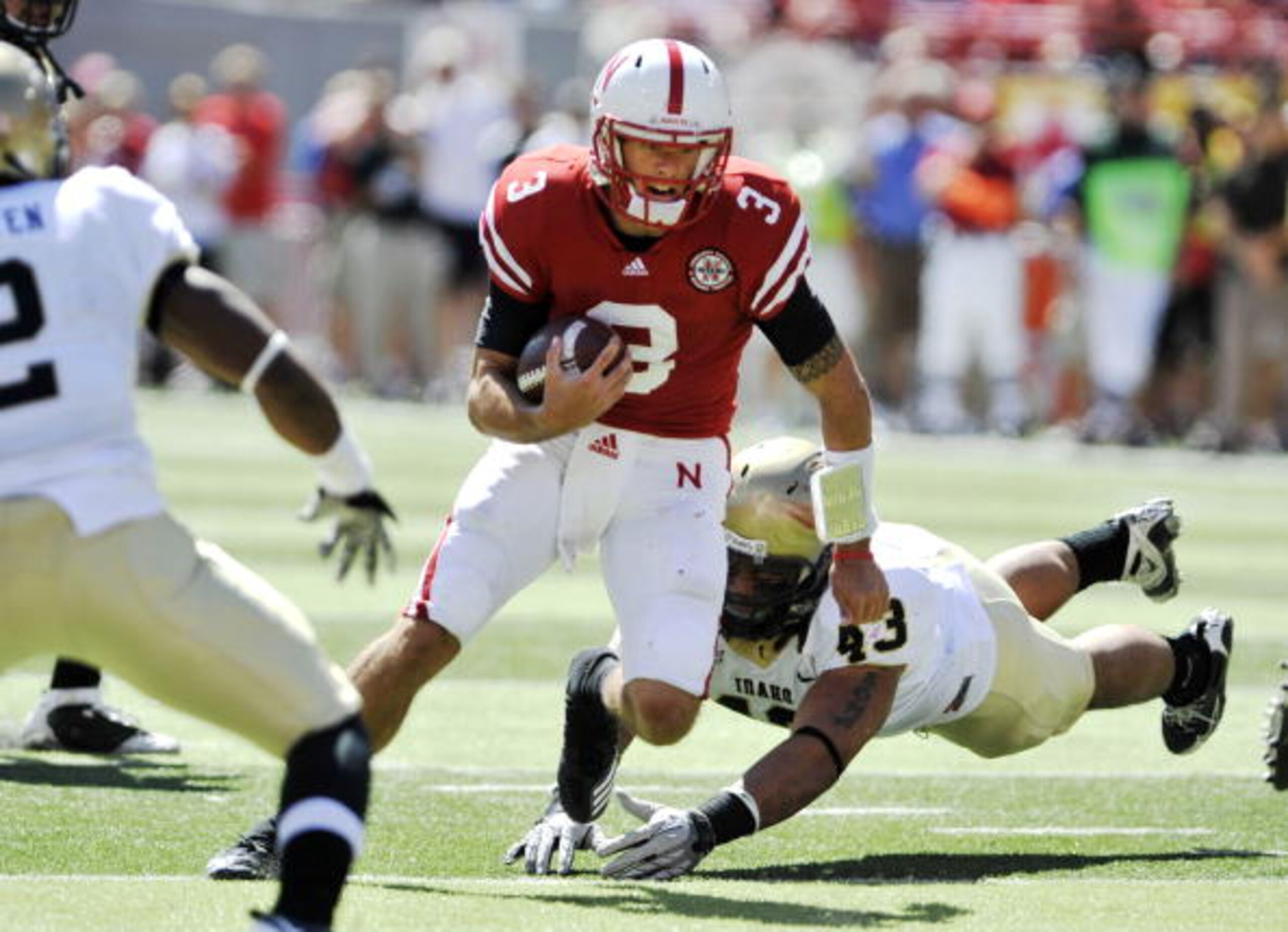 LINCOLN, NEBRASKA - SEPTEMBER 11: Nebraska Cornhuskers quarterback Taylor Martinez #3 works twoard the endzone during first half action of their game at Memorial Stadium on September 4, 2010 in Lincoln, Nebraska. Martinez covered the ball in the end zone LINCOLN, NEBRASKA - SEPTEMBER 11: Nebraska Cornhuskers quarterback Taylor Martinez #3 works twoard the endzone during first half action of their game at Memorial Stadium on September 4, 2010 in Lincoln, Nebraska. Martinez covered the ball in the end zone