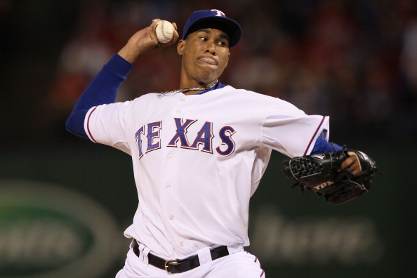 ARLINGTON, TX - OCTOBER 31:  Alexi Ogando #64 of the Texas Rangers pitches against the San Francisco Giants in Game Four of the 2010 MLB World Series at Rangers Ballpark in Arlington on October 31, 2010 in Arlington, Texas.  (Photo by Elsa/Getty Images)