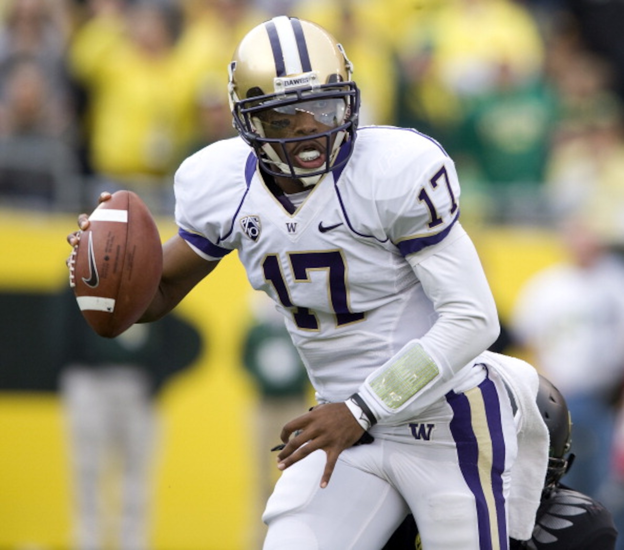 EUGENE, OR - NOVEMBER 06: Quarterback Keith Price #17 of the Washington Huskies scrambles out of the pocket in the third quarter of the game against the Oregon Ducks at Autzen Stadium on November 6, 2010 in Eugene, Oregon. The Ducks won the game 53-16. (P EUGENE, OR - NOVEMBER 06: Quarterback Keith Price #17 of the Washington Huskies scrambles out of the pocket in the third quarter of the game against the Oregon Ducks at Autzen Stadium on November 6, 2010 in Eugene, Oregon. The Ducks won the game 53-16. (P