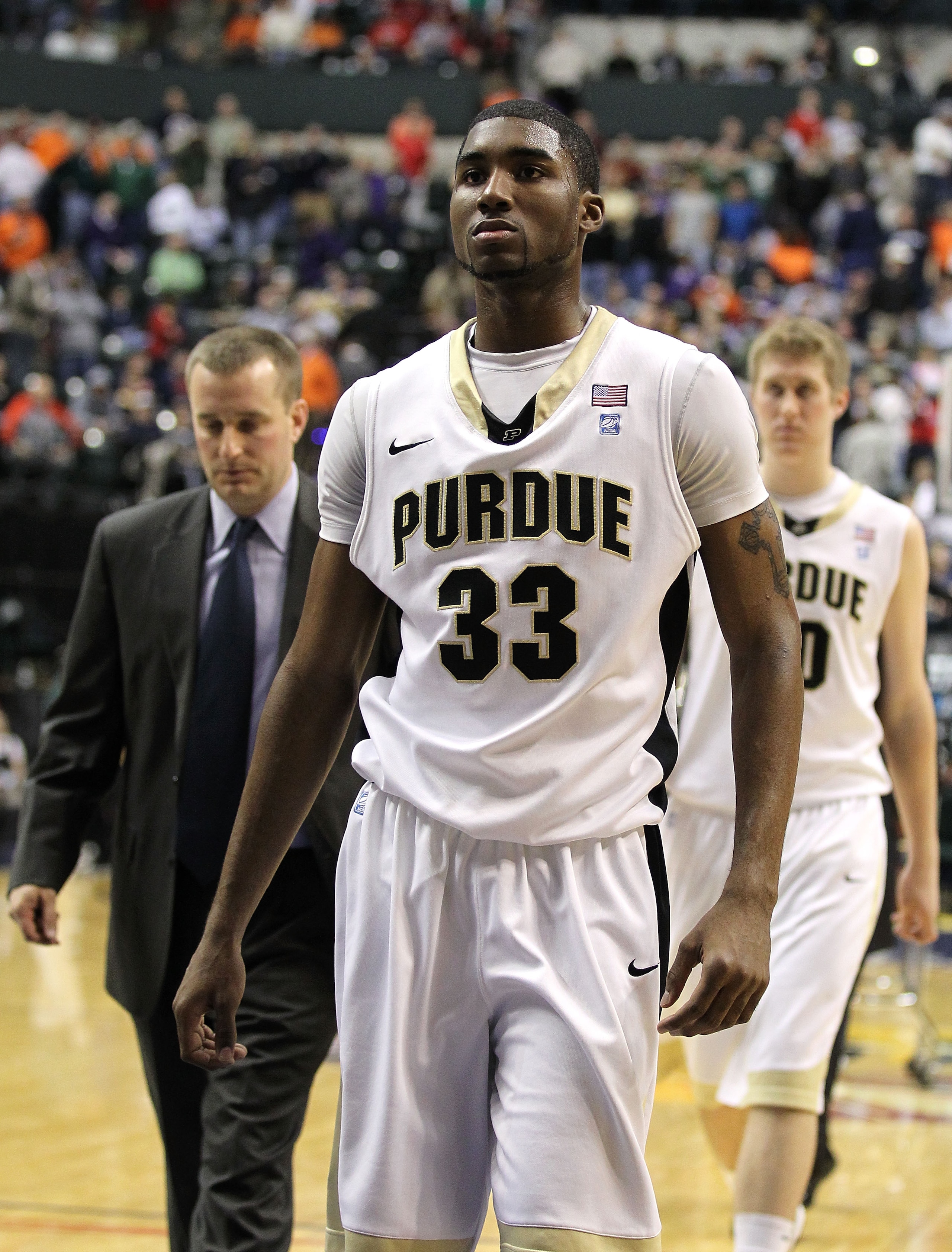 INDIANAPOLIS, IN - MARCH 11: E'Twaun Moore #33 of the Purdue Boilermakers walks off the court dejected after they lost 74-56 against the Michigan State Spartans during the quarterfinals of the 2011 Big Ten Men's Basketball Tournament at Conseco Fieldhou INDIANAPOLIS, IN - MARCH 11: E'Twaun Moore #33 of the Purdue Boilermakers walks off the court dejected after they lost 74-56 against the Michigan State Spartans during the quarterfinals of the 2011 Big Ten Men's Basketball Tournament at Conseco Fieldhou