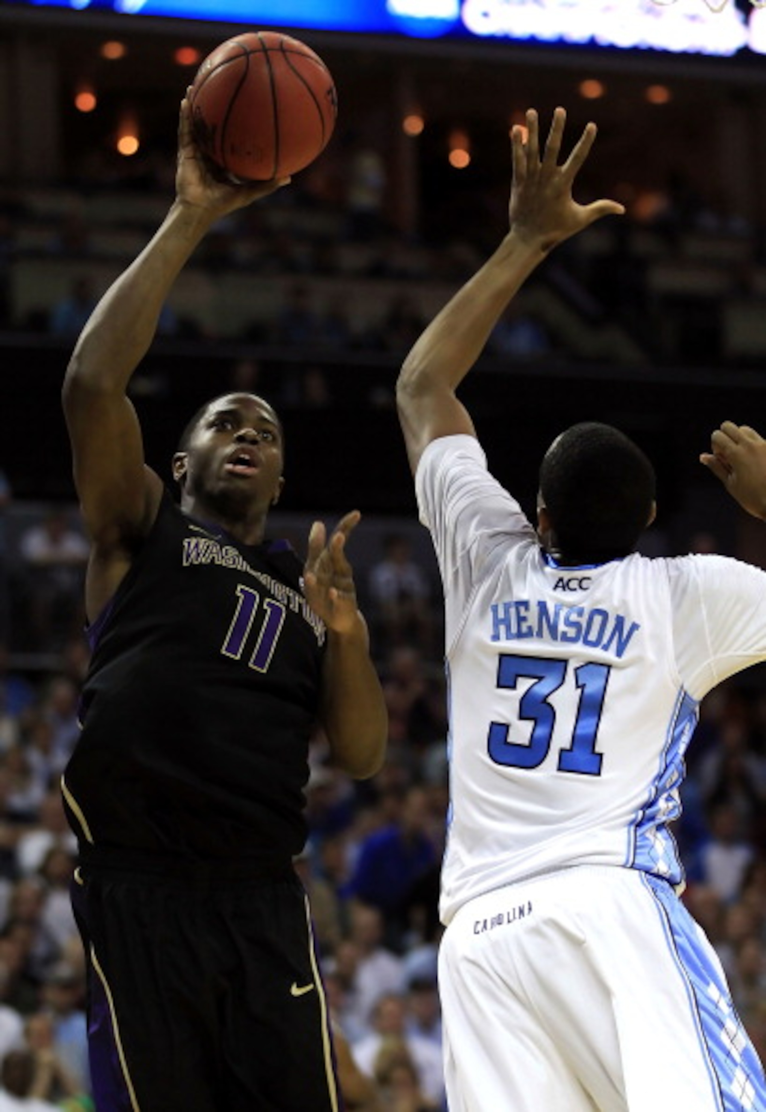 CHARLOTTE, NC - MARCH 20: Matthew Bryan-Amaning #11 of the Washington Huskies goes up for a shot against John Henson #31 of the North Carolina Tar Heels in the second half during the third round of the 2011 NCAA men's basketball tournament at Time Warner CHARLOTTE, NC - MARCH 20: Matthew Bryan-Amaning #11 of the Washington Huskies goes up for a shot against John Henson #31 of the North Carolina Tar Heels in the second half during the third round of the 2011 NCAA men's basketball tournament at Time Warner