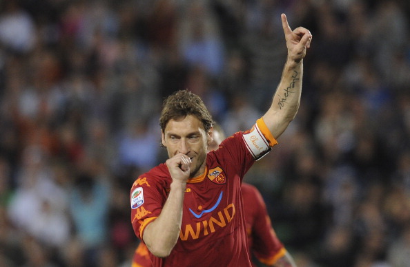 UDINE, ITALY - APRIL 09: Francesco Totti of Roma celebrates after scoring his opening penalty goal during the Serie A match between Udinese Calcio and AS Roma at Stadio Friuli on April 9, 2011 in Udine, Italy. (Photo by Dino Panato/Getty Images)