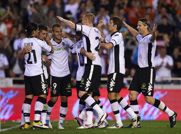 VALENCIA, VALENCIA - APRIL 10: Players of Valencia celebrate the third goal during the La Liga match between Valencia and Villarreal at Estadio Mestalla on April 10, 2011 in Valencia, Spain. (Photo by Manuel Queimadelos Alonso/Getty Images)