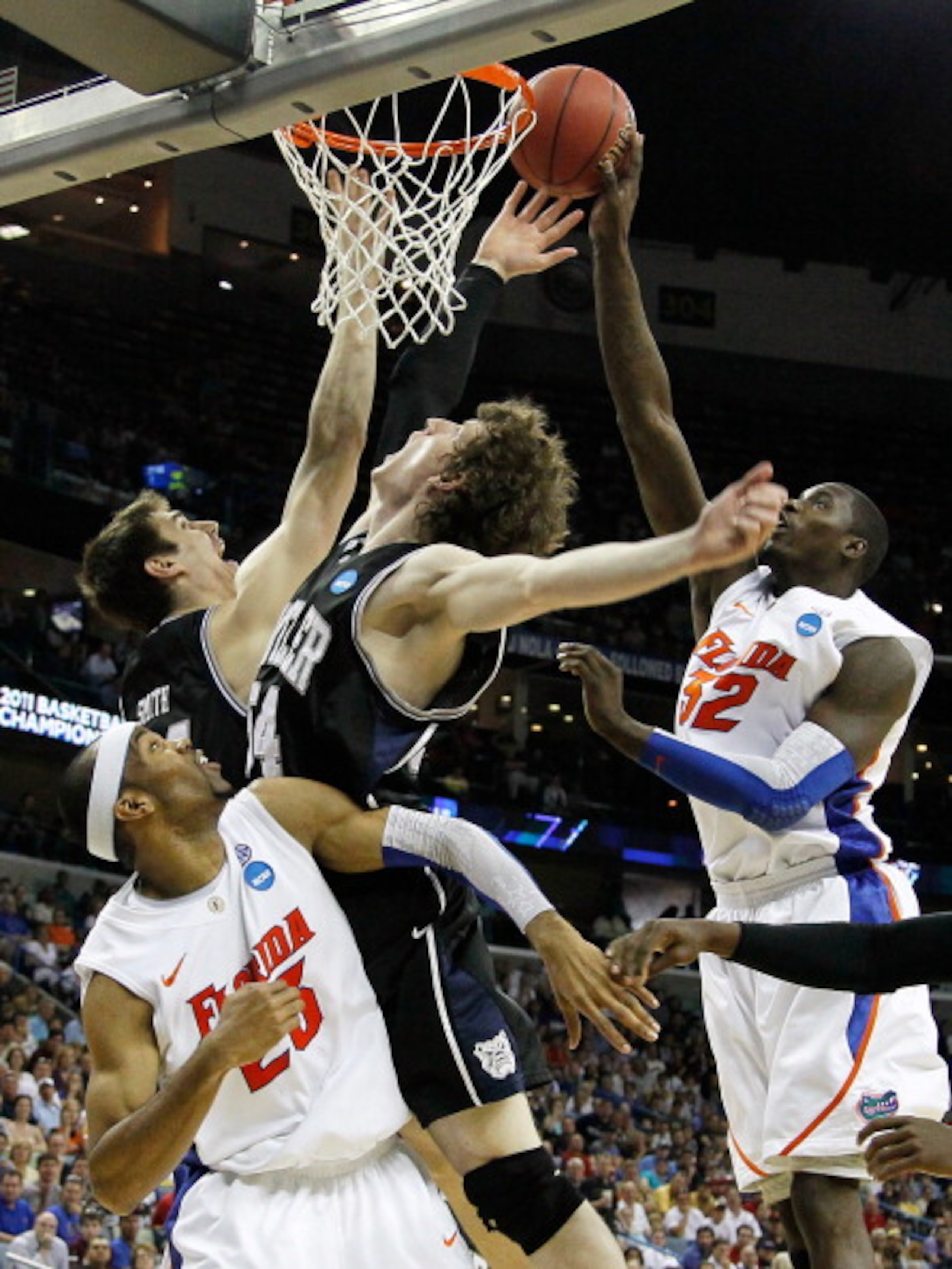 NEW ORLEANS, LA - MARCH 26: Vernon Macklin #32 of the Florida Gators shoots over Matt Howard #54 and Andrew Smith #44 of the Butler Bulldogs in the second half during the Southeast regional final of the 2011 NCAA men's basketball tournament at New Orlean NEW ORLEANS, LA - MARCH 26: Vernon Macklin #32 of the Florida Gators shoots over Matt Howard #54 and Andrew Smith #44 of the Butler Bulldogs in the second half during the Southeast regional final of the 2011 NCAA men's basketball tournament at New Orlean