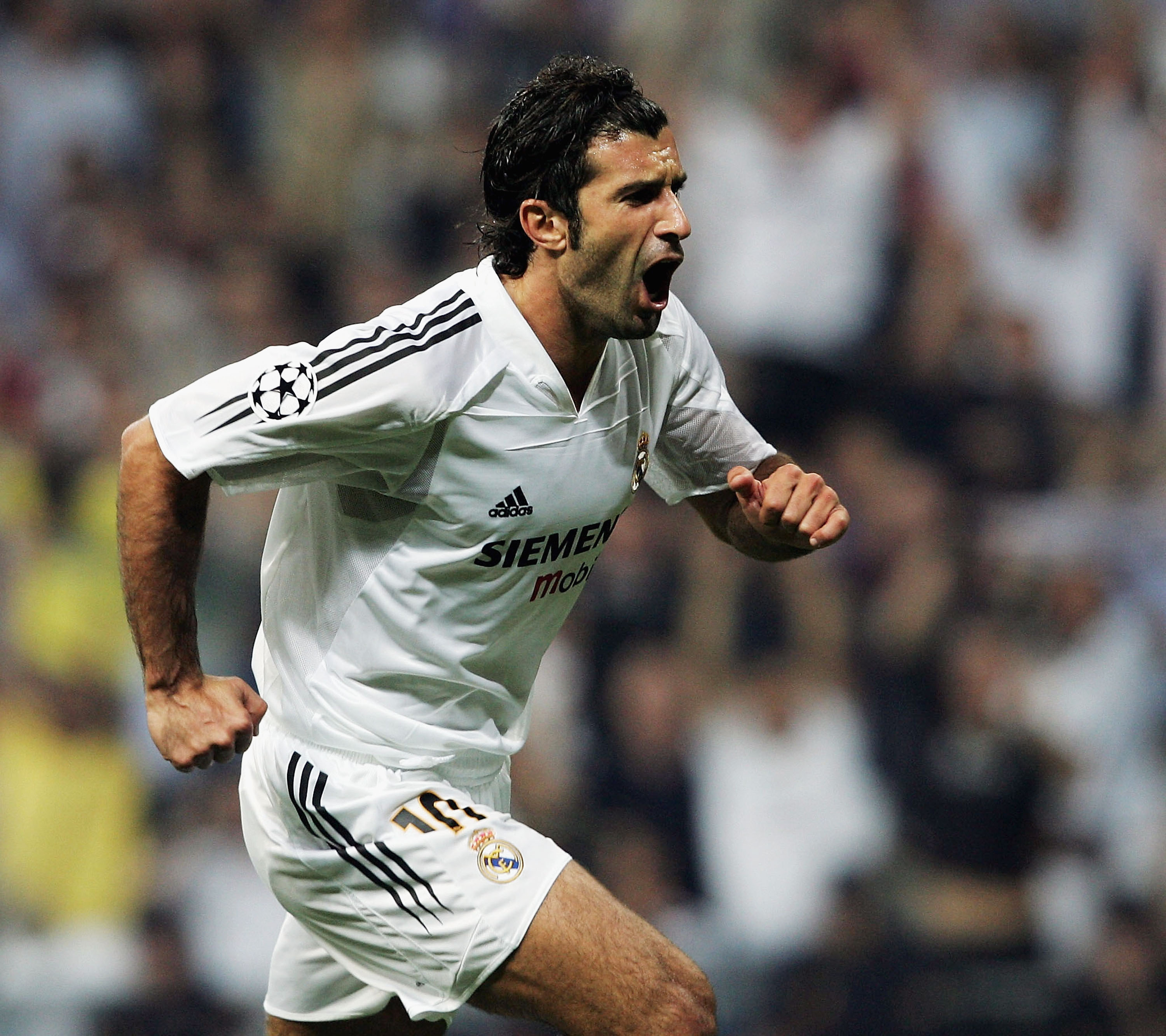 MADRID, SPAIN - SEPTEMBER 28:  Luis Figo of Real Madrid celebrates after scorig during the UEFA Champions League Group B match between Real Madrid and Roma at the Santiago Bernabeu Stadium on September 28, 2004 in Madrid, Spain.  (Photo by Shaun Botterill