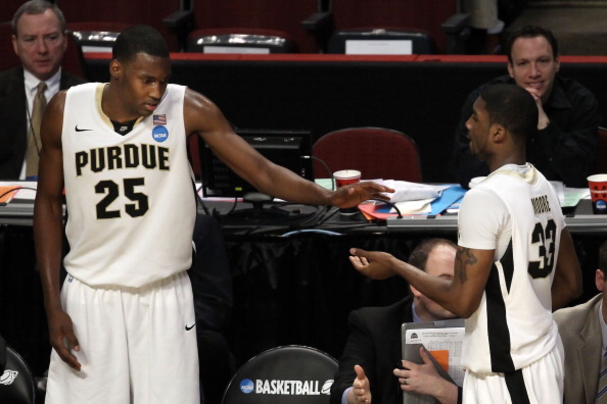CHICAGO, IL - MARCH 18: JaJuan Johnson #25 and E'Twaun Moore #33 of the Purdue Boilermakers congratule eachother on their win over the St. Peter's Peacocks during the second round of the 2011 NCAA men's basketball tournament at the United Center on March CHICAGO, IL - MARCH 18: JaJuan Johnson #25 and E'Twaun Moore #33 of the Purdue Boilermakers congratule eachother on their win over the St. Peter's Peacocks during the second round of the 2011 NCAA men's basketball tournament at the United Center on March