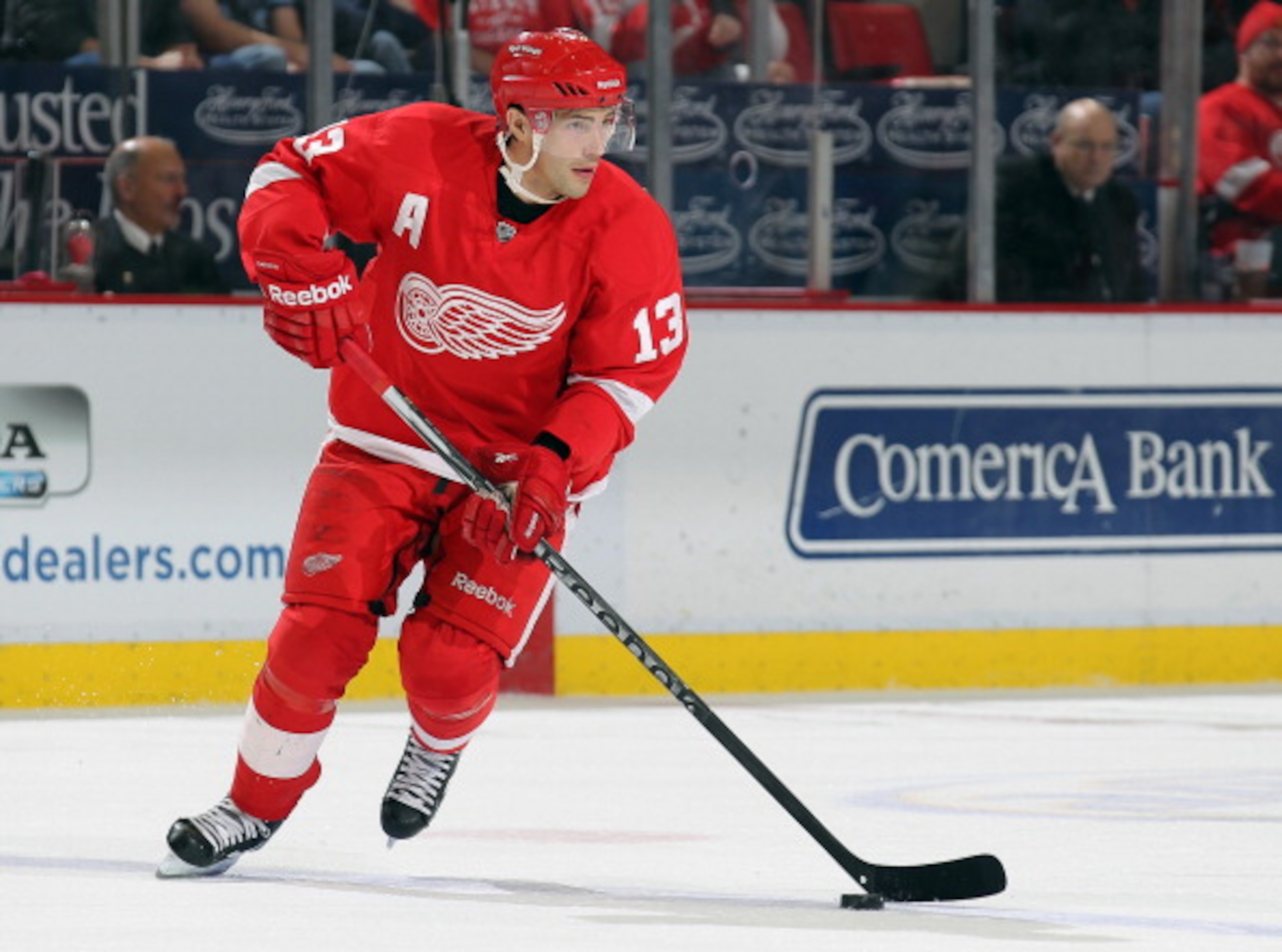 DETROIT,MI - DECEMBER 10:  Pavel Datsyuk #13 of the Detroit Red Wings skates with the puck during the game against the Montreal Canadiens at the Joe Louis Arena on December 10, 2010  in Detroit, Michigan. The Wings defeated the Canadiens 4-2. (Photo by Cl