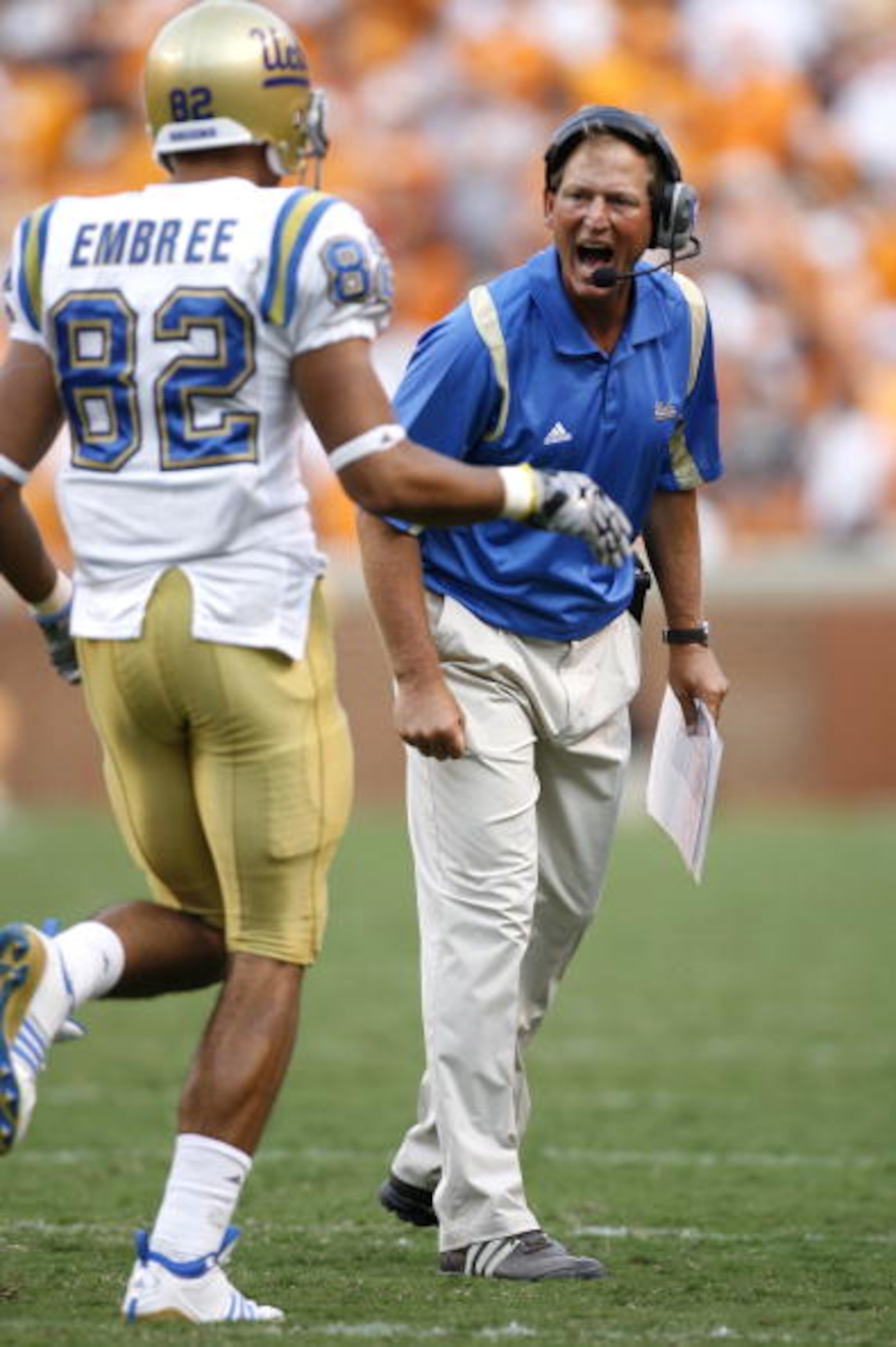 KNOXVILLE, TN - SEPTEMBER 12: Rick Neuheisel, head coach of the UCLA Bruins yells at Taylor Embree #82 of the UCLA Bruins against the Tennessee Volunteers on September 12, 2009 at Neyland Stadium in Knoxville, Tennessee. UCLA beat Tennessee 19-15. (Photo 