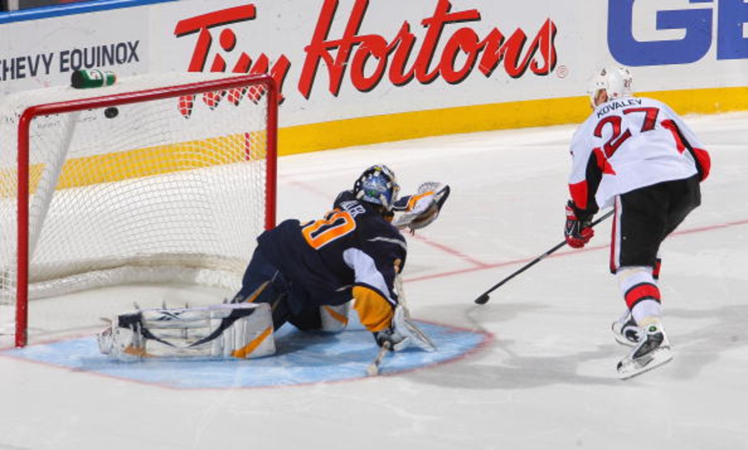 BUFFALO, NY - DECEMBER 26: Alex Kovalev #27 of the Ottawa Senators scores the game winning goal in the shootout on Ryan Miller #30 of the Buffalo Sabres  at HSBC Arena on December 26, 2009 in Buffalo, New York. Ottawa won 3-2 in a shootout. (Photo by Rick