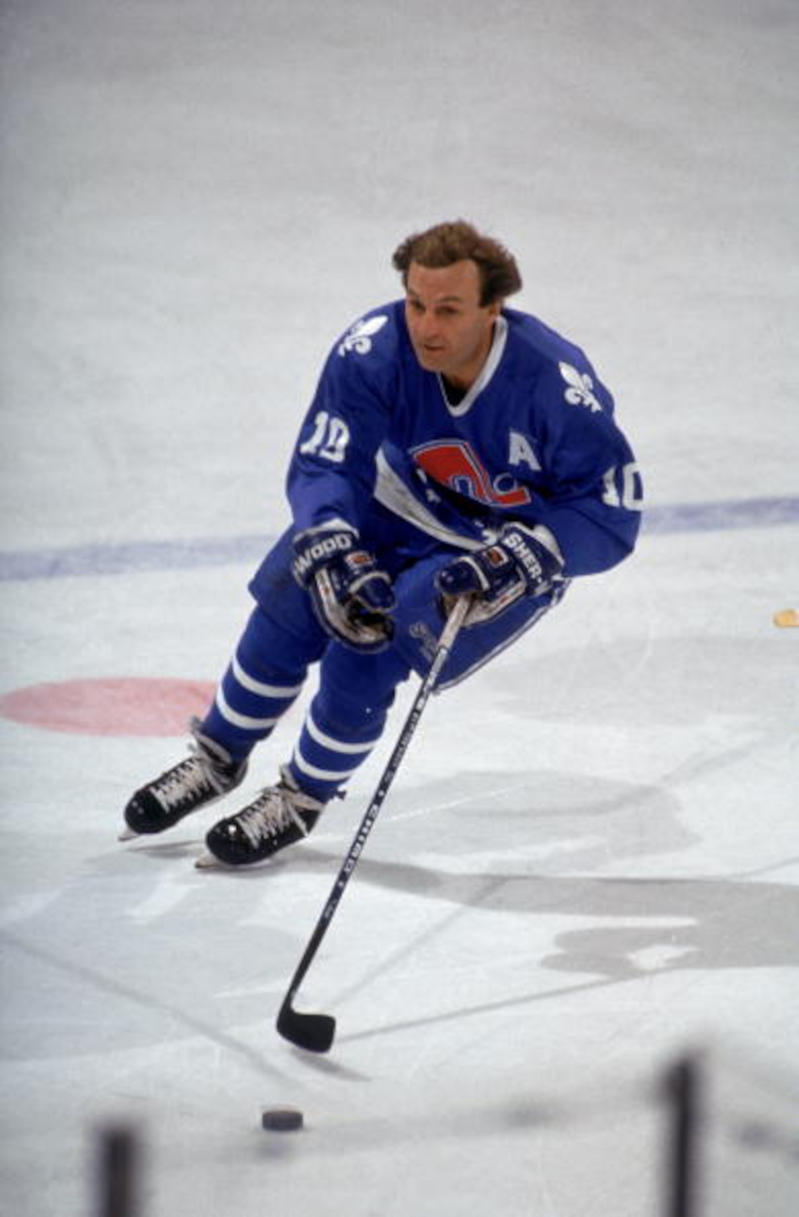 BUFFALO, NY - 1990:  Right wing Guy Lafleur #01 of the Quebec Nordiques skates with the puck during warmups prior to a 1990 NHL game against the Buffalo Sabres at the Memorial Auditorium in Buffalo, New York.  (Photo by Rick Stewart/Getty Images)