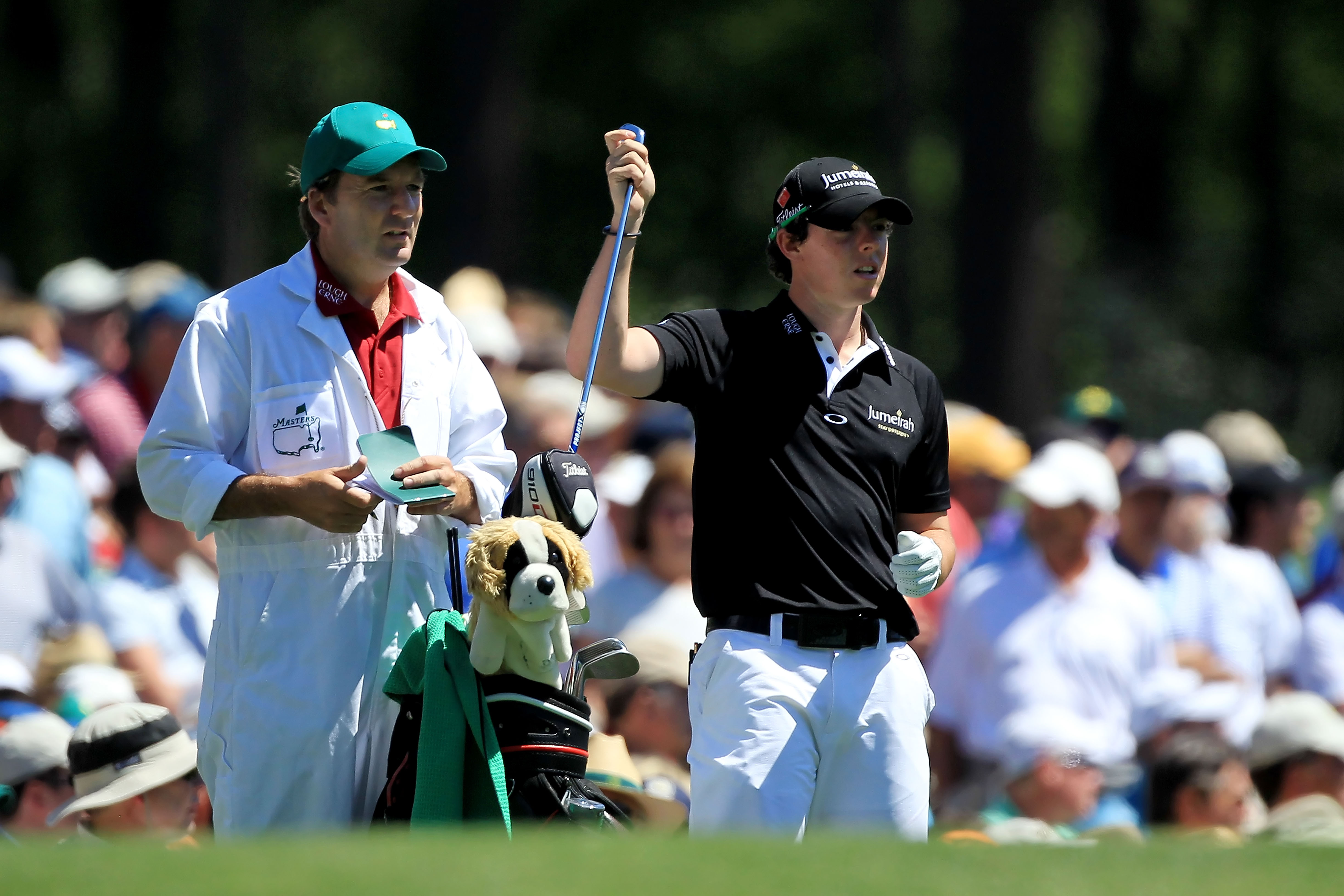 AUGUSTA, GA - APRIL 07:  Rory McIlroy of Northern Ireland pulls a club alongside his caddie J.P. Fitzgerald on the 12th hole during the first round of the 2011 Masters Tournament at Augusta National Golf Club on April 7, 2011 in Augusta, Georgia.  (Photo