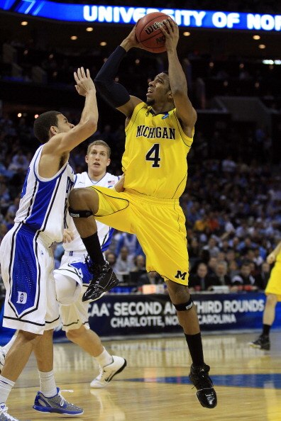 CHARLOTTE, NC - MARCH 20:  Darius Morris #4 of the Michigan Wolverines goes up for a shot against Seth Curry #30 of the Duke Blue Devils during the third round of the 2011 NCAA men's basketball tournament at Time Warner Cable Arena on March 20, 2011 in Ch