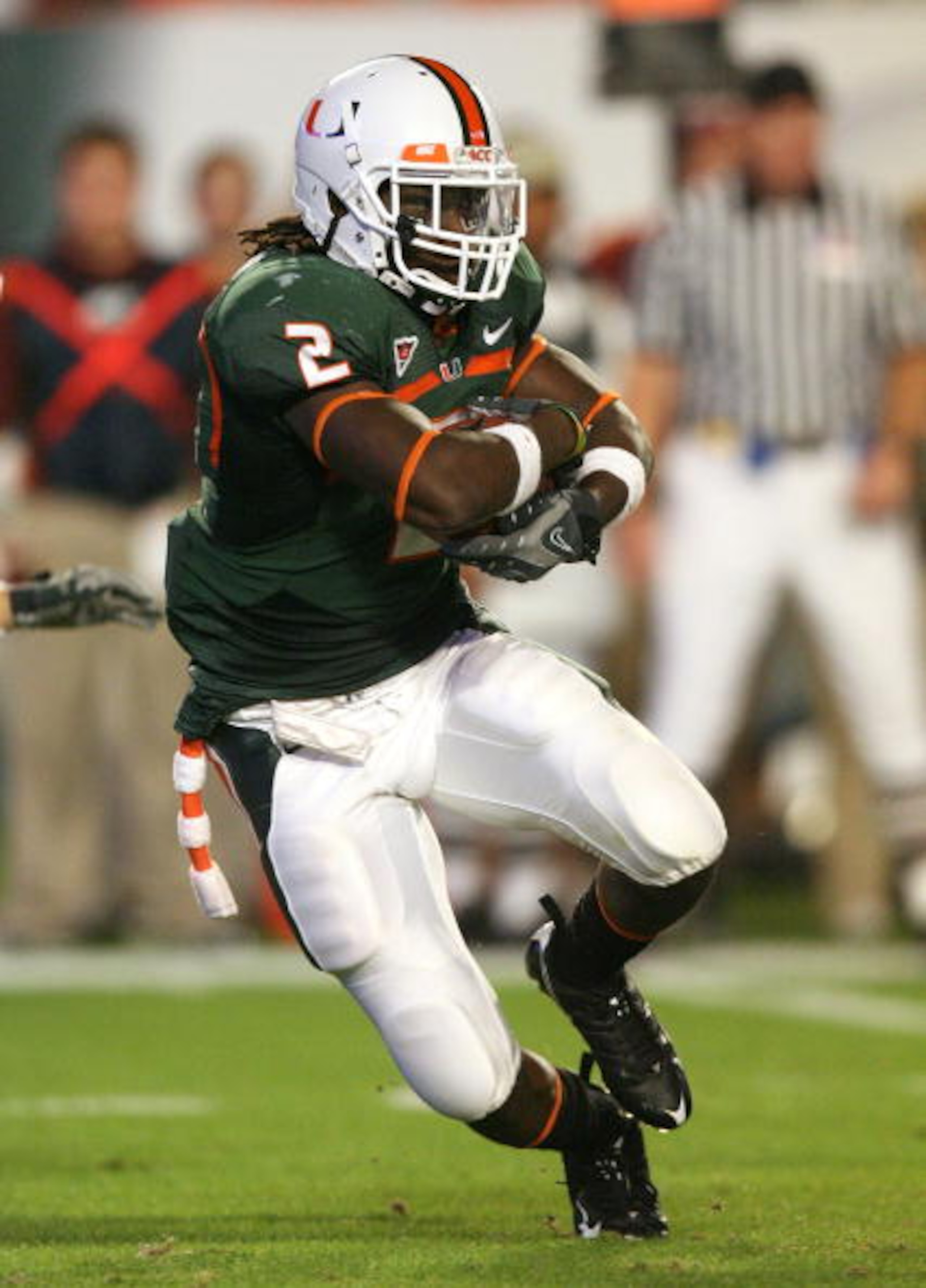 MIAMI - NOVEMBER 13: Running back Graig Cooper #2 of the Miami Hurricanes looks for room to run while taking on the Virginia Tech Hokies at Dolphin Stadium on November 13, 2008 in Miami, Florida.  (Photo by Doug Benc/Getty Images)