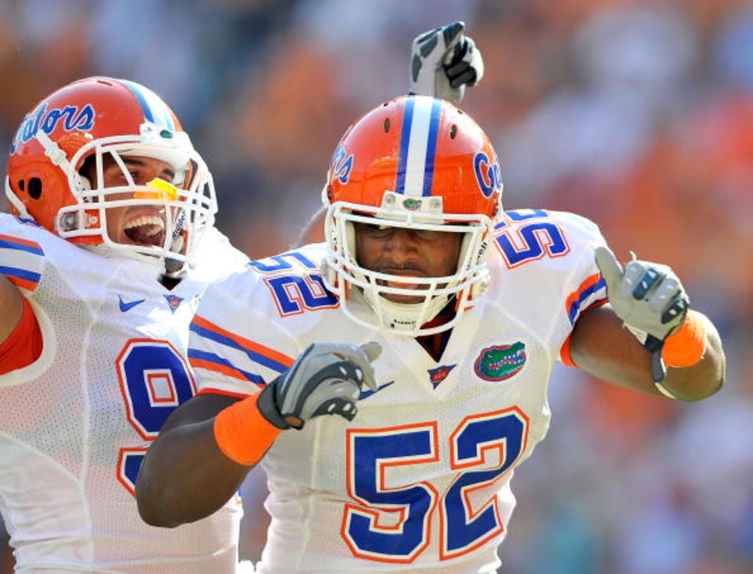 KNOXVILLE, TN - SEPTEMBER 18: Jonathan Bostic #52 of the Florida Gators celebrates with teammate Justin Trattou #94 after intercepting a pass by quarterback Matt Simms #2 of the Tennessee Volunteers in the end zone during the first half at Neyland Stadiu KNOXVILLE, TN - SEPTEMBER 18: Jonathan Bostic #52 of the Florida Gators celebrates with teammate Justin Trattou #94 after intercepting a pass by quarterback Matt Simms #2 of the Tennessee Volunteers in the end zone during the first half at Neyland Stadiu