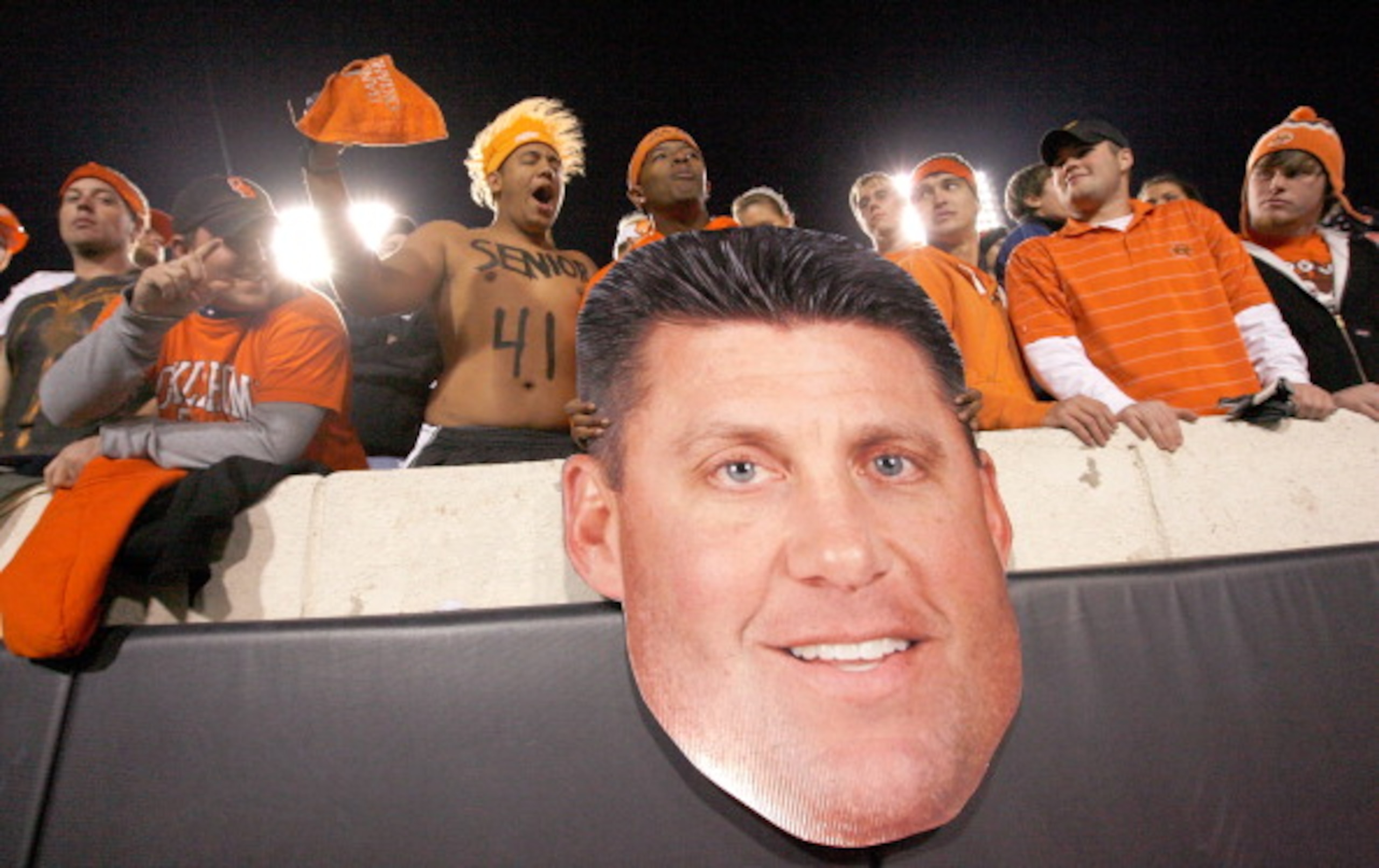 STILLWATER, OK - NOVEMBER 27: Oklahoma State Cowboy fans cheer with a cardboard cutout of Oklahoma State head coach Mike Gundy as the Cowboys prepare to take on the Oklahoma Soones at Boone Pickens Stadium on November 27, 2010 in Stillwater, Oklahoma. ( STILLWATER, OK - NOVEMBER 27: Oklahoma State Cowboy fans cheer with a cardboard cutout of Oklahoma State head coach Mike Gundy as the Cowboys prepare to take on the Oklahoma Soones at Boone Pickens Stadium on November 27, 2010 in Stillwater, Oklahoma. (