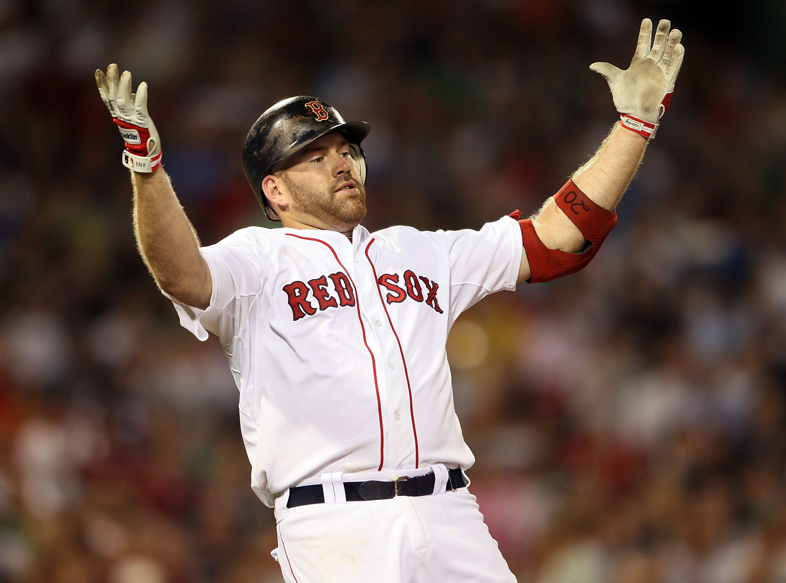 BOSTON - JULY 15:  Kevin Youkilis #20 of the Boston Red Sox reacts after he hit a pop fly out in the sixth inning against the Texas Rangers on July 15, 2010 at Fenway Park in Boston, Massachusetts.  (Photo by Elsa/Getty Images)