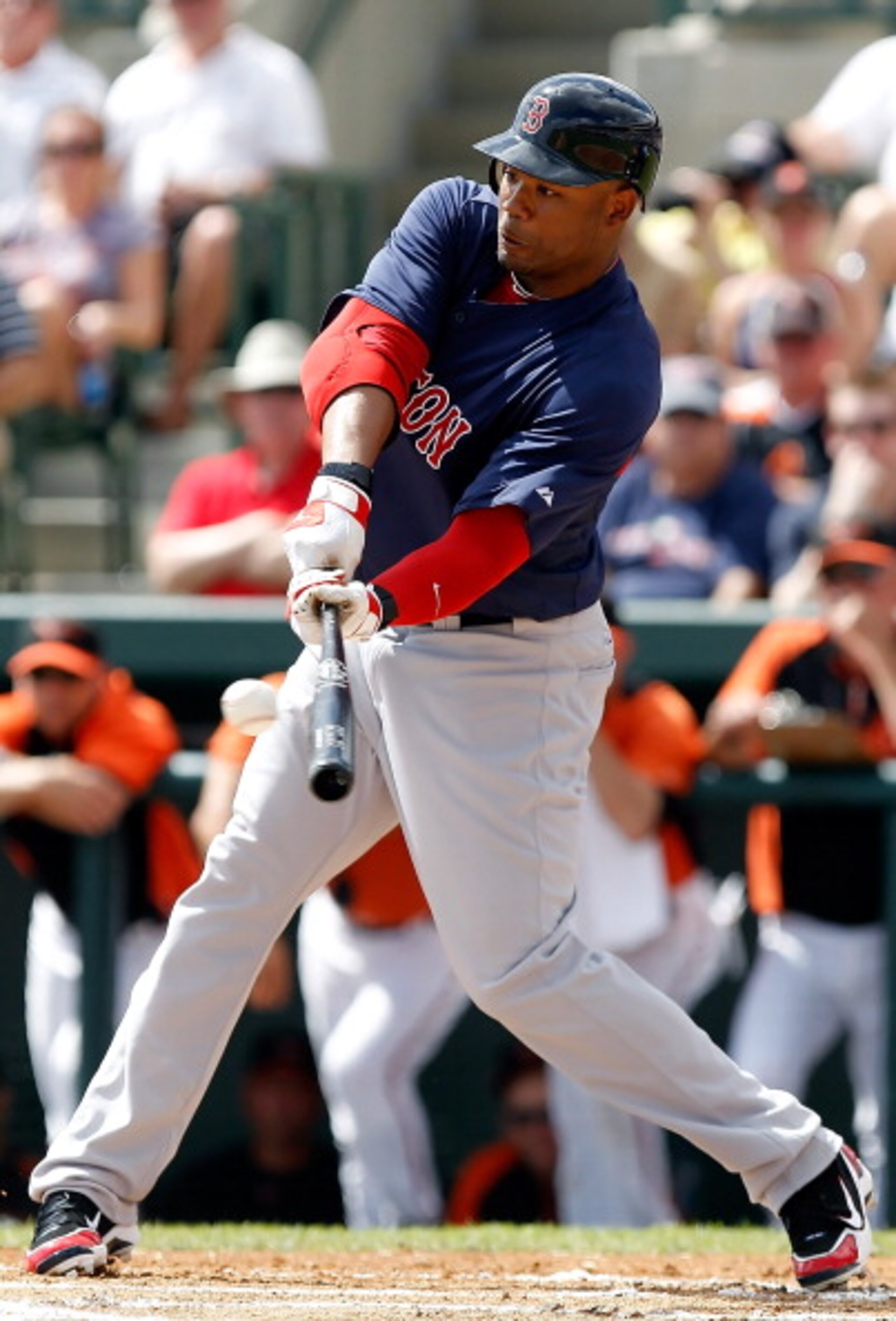 SARASOTA, FL - MARCH 05:  Outfielder Carl Crawford #13 of the Boston Red Sox fouls off a pitch against the Baltimore Orioles during a Grapefruit League Spring Training Game at Ed Smith Stadium on March 5, 2011 in Sarasota, Florida.  (Photo by J. Meric/Get