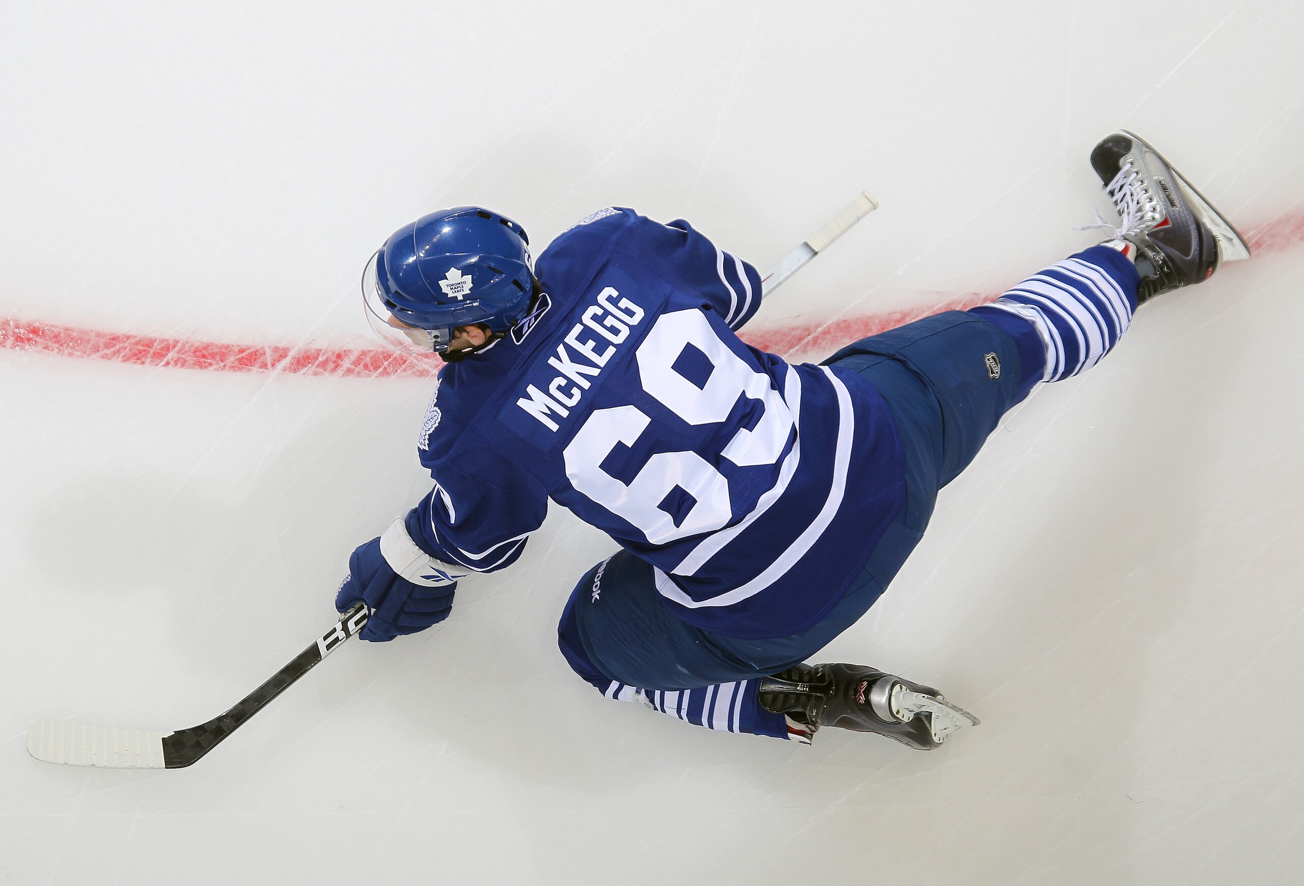 LONDON,ON - SEPTEMBER 23: Greg McKegg #69 of the Toronto Maple Leafs stretches in the warm-up prior to a pre-season game against the Philadelphia Flyers on September 23,2010 at the John Labatt Centre in London, Ontario. The Leafs defeated the Flyers 3-2 i