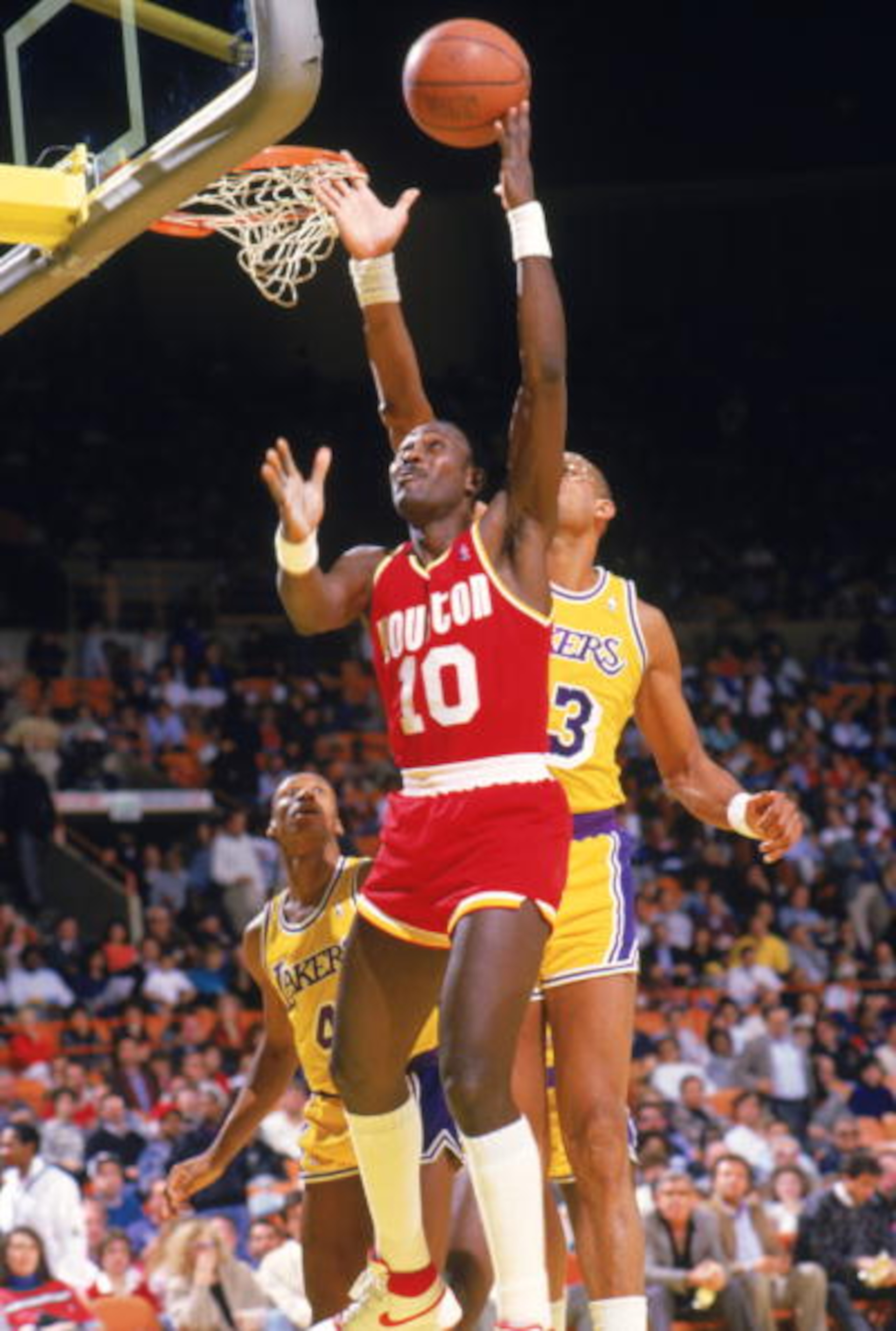 INGLEWOOD -1987: Purvis Short #10 of the Houston Rockets goes to the basket during a game in the 1987-88 season against the Los Angeles Lakers at the Forum in Inglewood, California. NOTE TO USER: User expressly acknowledges and agrees that, by downloadin INGLEWOOD -1987: Purvis Short #10 of the Houston Rockets goes to the basket during a game in the 1987-88 season against the Los Angeles Lakers at the Forum in Inglewood, California. NOTE TO USER: User expressly acknowledges and agrees that, by downloadin