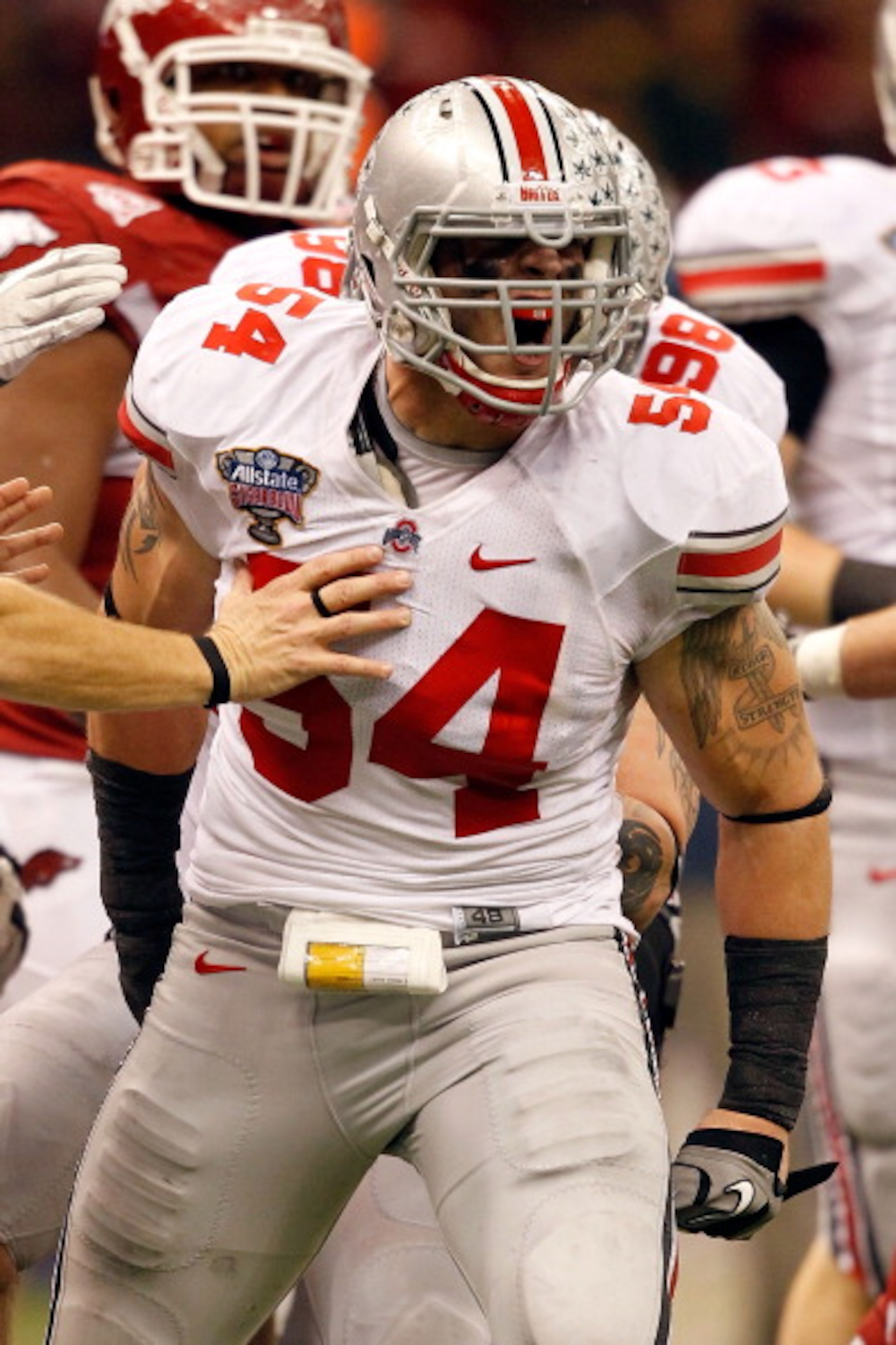 NEW ORLEANS, LA - JANUARY 04: John Simon #54 of the Ohio State Buckeyes reacts after hitting quarterback Ryan Mallett #15 of the Arkansas Razorbacks in the second quarter during the Allstate Sugar Bowl at the Louisiana Superdome on January 4, 2011 in New NEW ORLEANS, LA - JANUARY 04: John Simon #54 of the Ohio State Buckeyes reacts after hitting quarterback Ryan Mallett #15 of the Arkansas Razorbacks in the second quarter during the Allstate Sugar Bowl at the Louisiana Superdome on January 4, 2011 in New