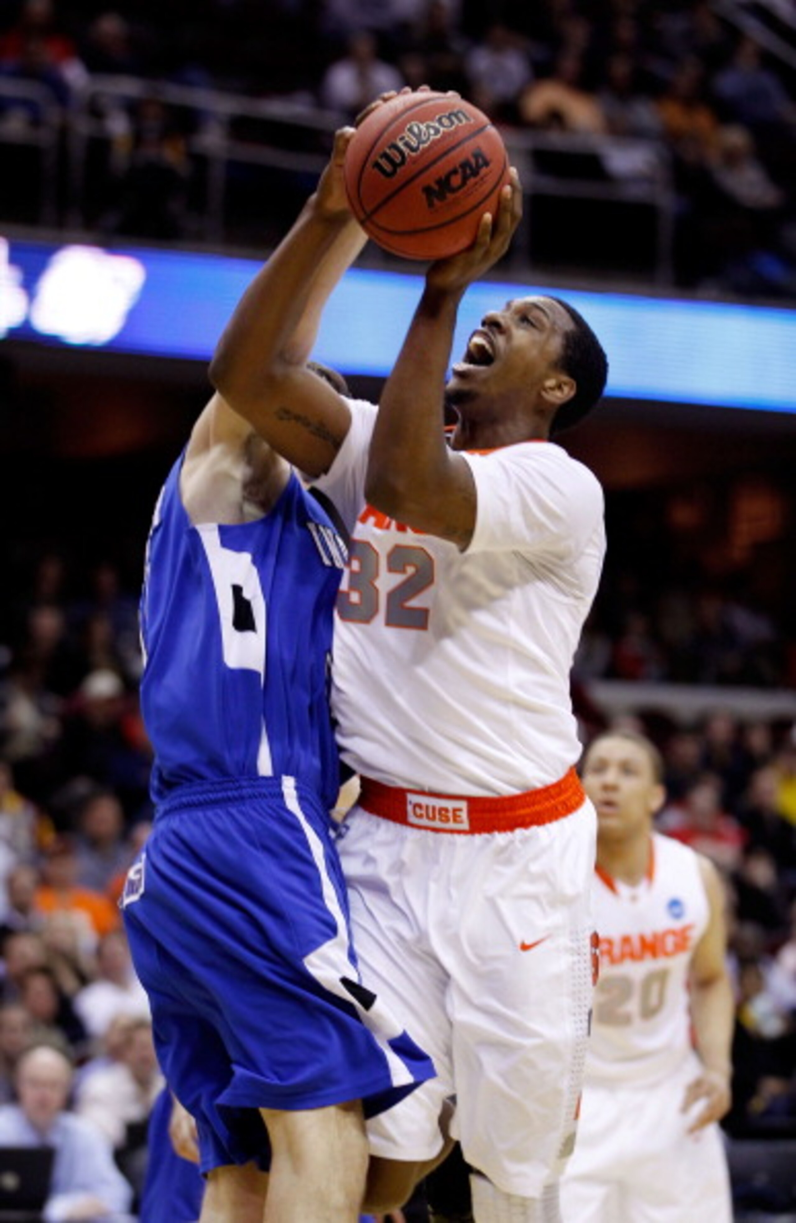 CLEVELAND, OH - MARCH 18: Kris Joseph #32 of the Syracuse Orange drives to the basket against the Indiana State Sycamores during the second round of the 2011 NCAA men's basketball tournament at Quicken Loans Arena on March 18, 2011 in Cleveland, Ohio. (P CLEVELAND, OH - MARCH 18: Kris Joseph #32 of the Syracuse Orange drives to the basket against the Indiana State Sycamores during the second round of the 2011 NCAA men's basketball tournament at Quicken Loans Arena on March 18, 2011 in Cleveland, Ohio. (P