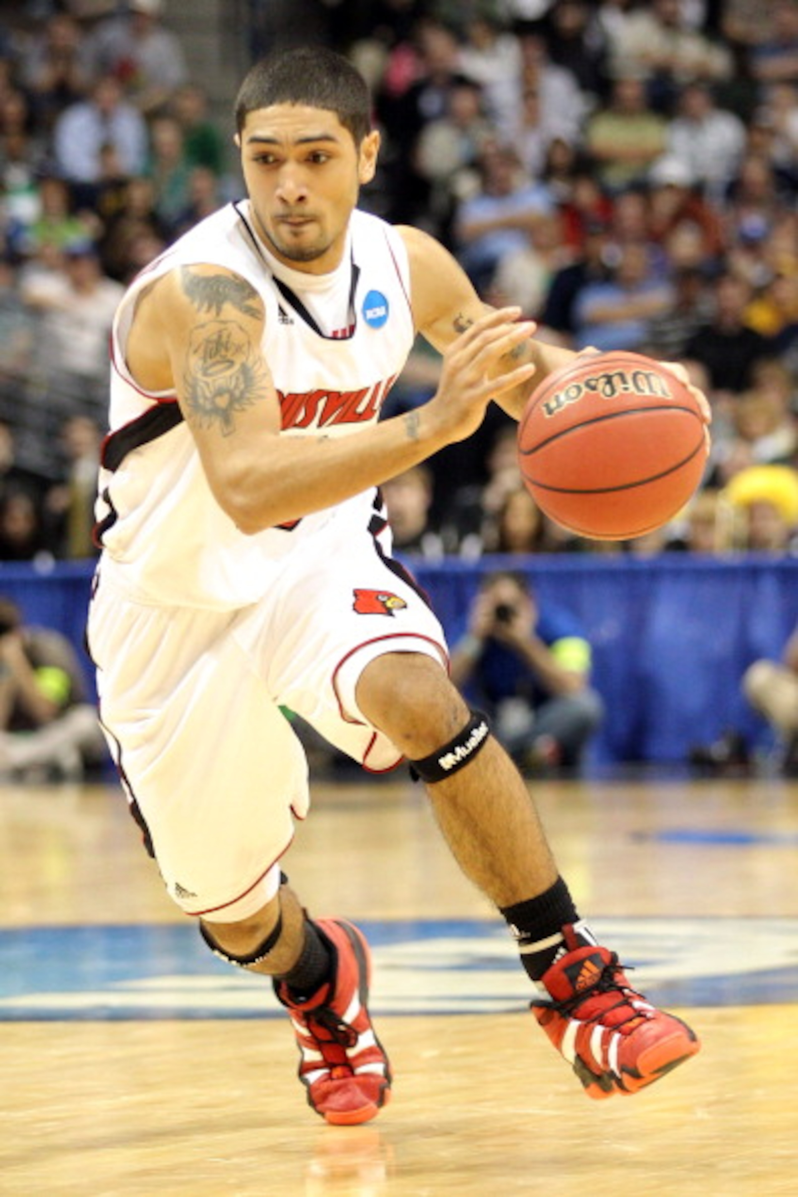 DENVER, CO - MARCH 17: Peyton Siva #3 of the Louisville Cardinals handles the ball against the Morehead State Eagles during the second round of the 2011 NCAA men's basketball tournament at Pepsi Center on March 17, 2011 in Denver, Colorado. (Photo by Ju DENVER, CO - MARCH 17: Peyton Siva #3 of the Louisville Cardinals handles the ball against the Morehead State Eagles during the second round of the 2011 NCAA men's basketball tournament at Pepsi Center on March 17, 2011 in Denver, Colorado. (Photo by Ju