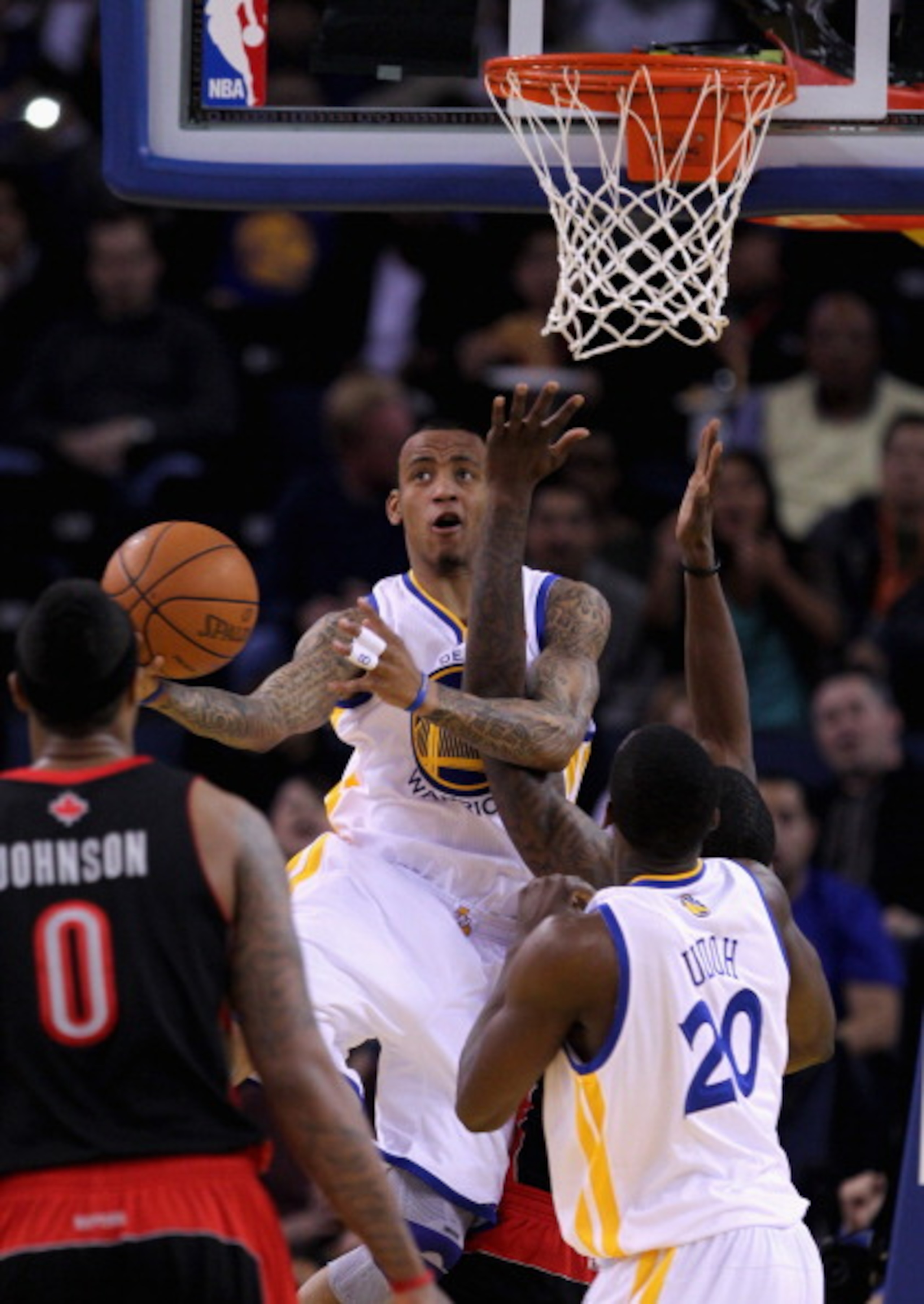 OAKLAND, CA - MARCH 25: Monta Ellis #8 of the Golden State Warriors is fouled while going up for a shot against the Toronto Raptors at Oracle Arena on March 25, 2011 in Oakland, California. NOTE TO USER: User expressly acknowledges and agrees that, by dow OAKLAND, CA - MARCH 25: Monta Ellis #8 of the Golden State Warriors is fouled while going up for a shot against the Toronto Raptors at Oracle Arena on March 25, 2011 in Oakland, California. NOTE TO USER: User expressly acknowledges and agrees that, by dow