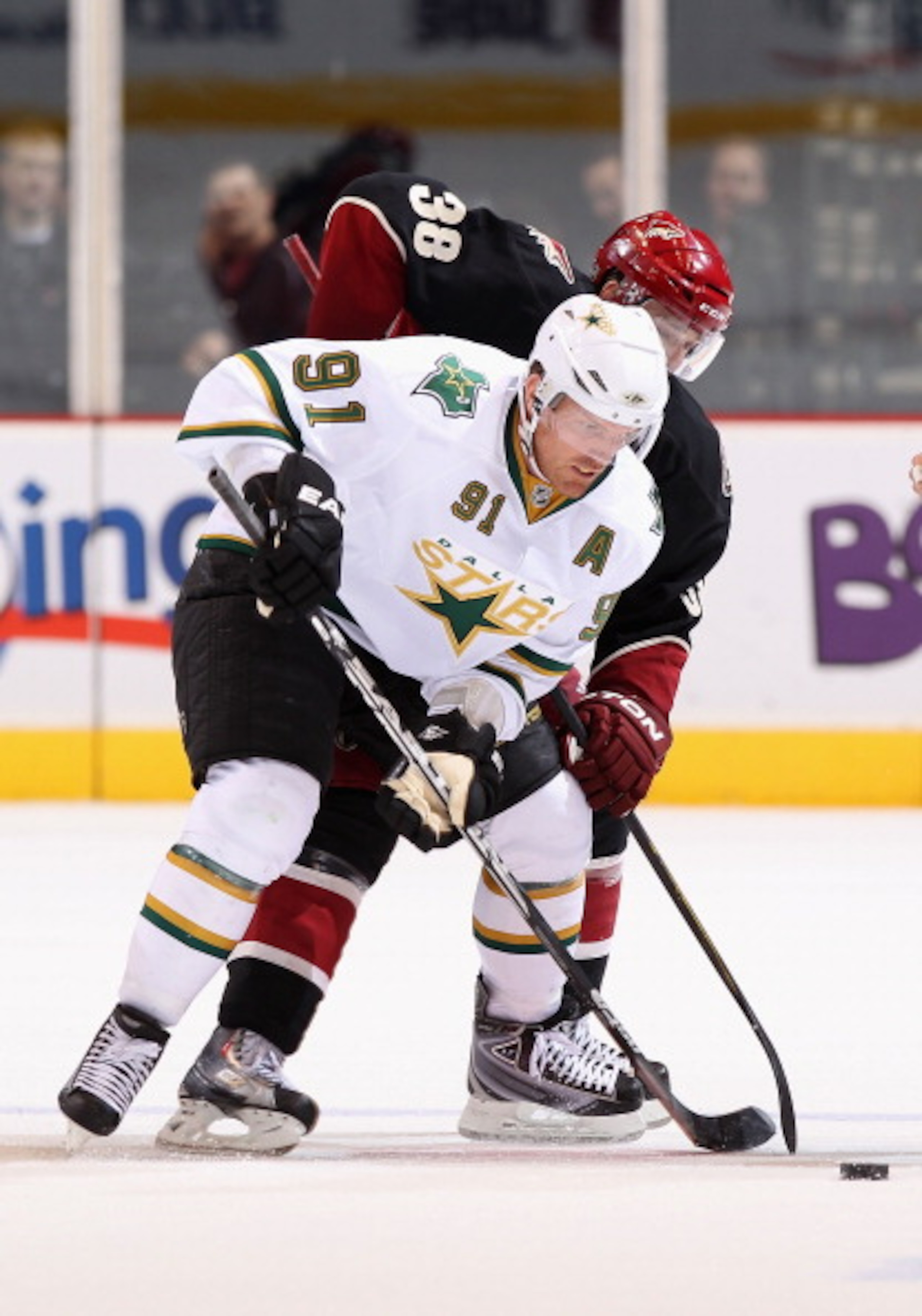 GLENDALE, AZ - MARCH 29:  Brad Richards #91 of the Dallas Stars takes a face off during the NHL game against the Phoenix Coyotes at Jobing.com Arena on March 29, 2011 in Glendale, Arizona. The Coyotes defeated the Stars 2-1 in an overtime shoot out.  (Pho