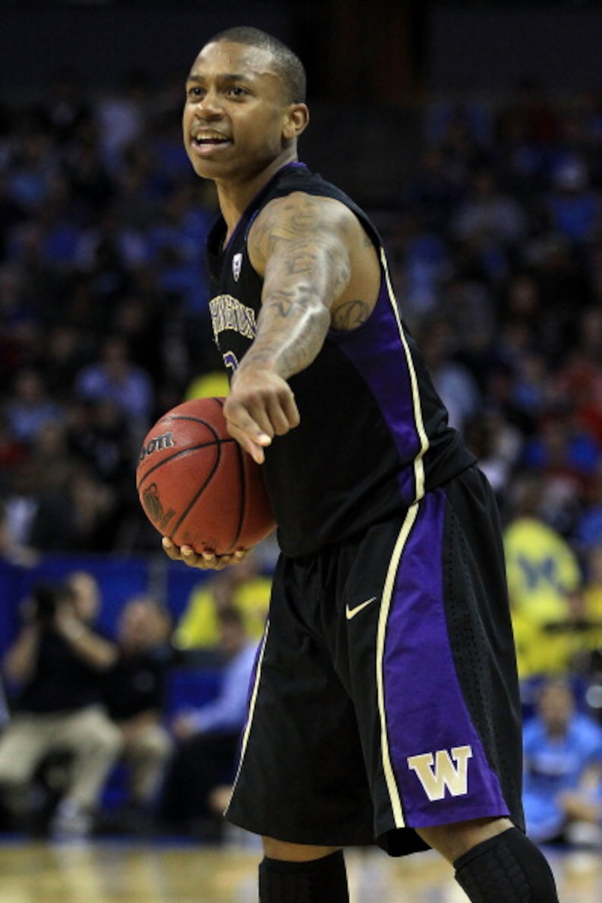 CHARLOTTE, NC - MARCH 20: Isaiah Thomas #2 of the Washington Huskies points while taking on the North Carolina Tar Heels during the third round of the 2011 NCAA men's basketball tournament at Time Warner Cable Arena on March 20, 2011 in Charlotte, North CHARLOTTE, NC - MARCH 20: Isaiah Thomas #2 of the Washington Huskies points while taking on the North Carolina Tar Heels during the third round of the 2011 NCAA men's basketball tournament at Time Warner Cable Arena on March 20, 2011 in Charlotte, North