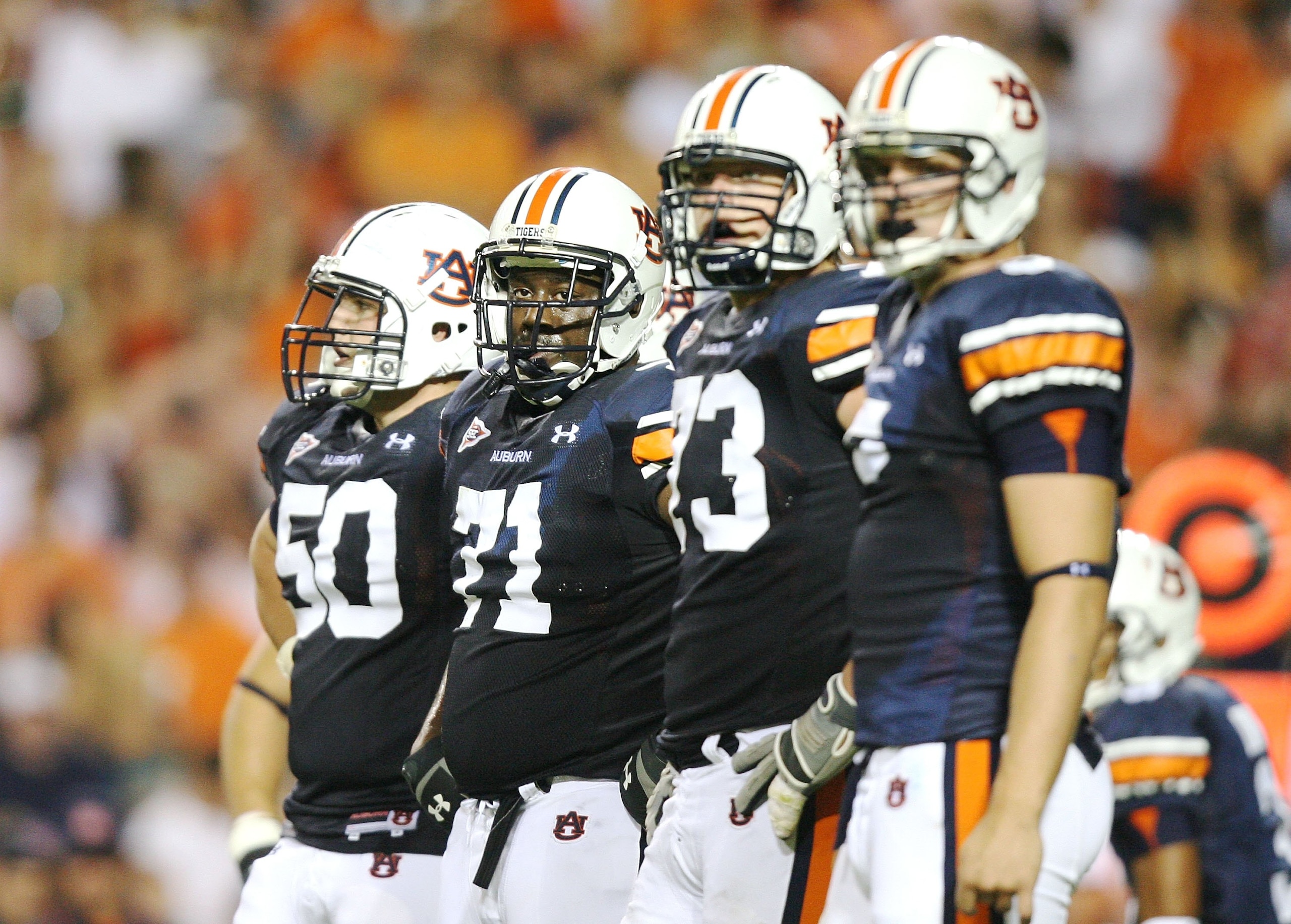 AUBURN, AL - SEPTEMBER 20:  Offensive lineman Ryan Pugh #50, Tyronne Green #71, Lee Ziemba #73 and tight end Tommy Trott #5 of the Auburn Tigers prepare for a play while taking on the LSU Tigers at Jordan-Hare Stadium on September 20, 2008 in Auburn, Alab