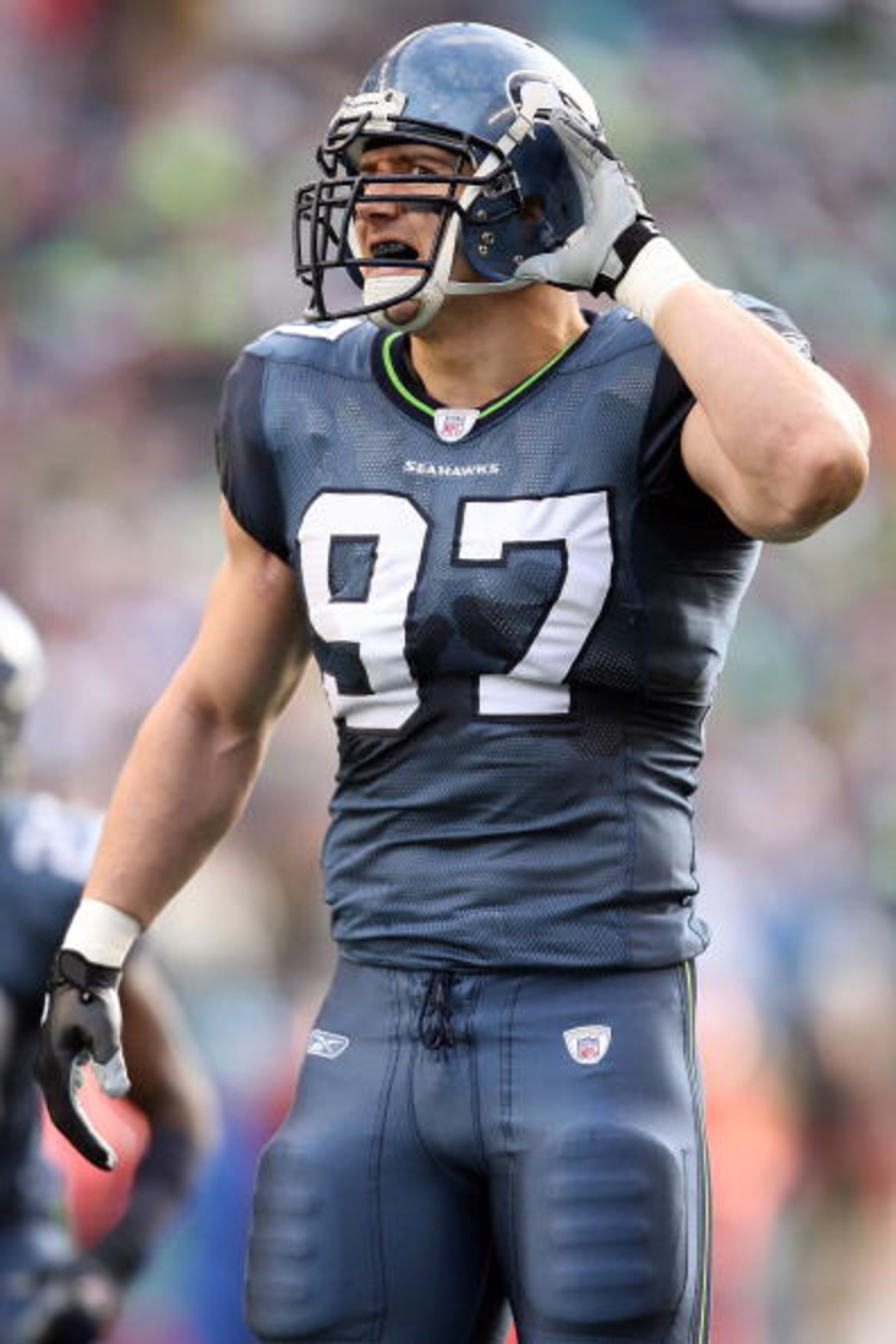 SEATTLE - JANUARY 05:  Defensive end Patrick Kerney #97 of the Seattle Seahawks listens from the field in the first quarter against the Washington Redskins during the NFC Wild Card game at Qwest Field on January 5, 2008 in Seattle, Washington.  (Photo by 