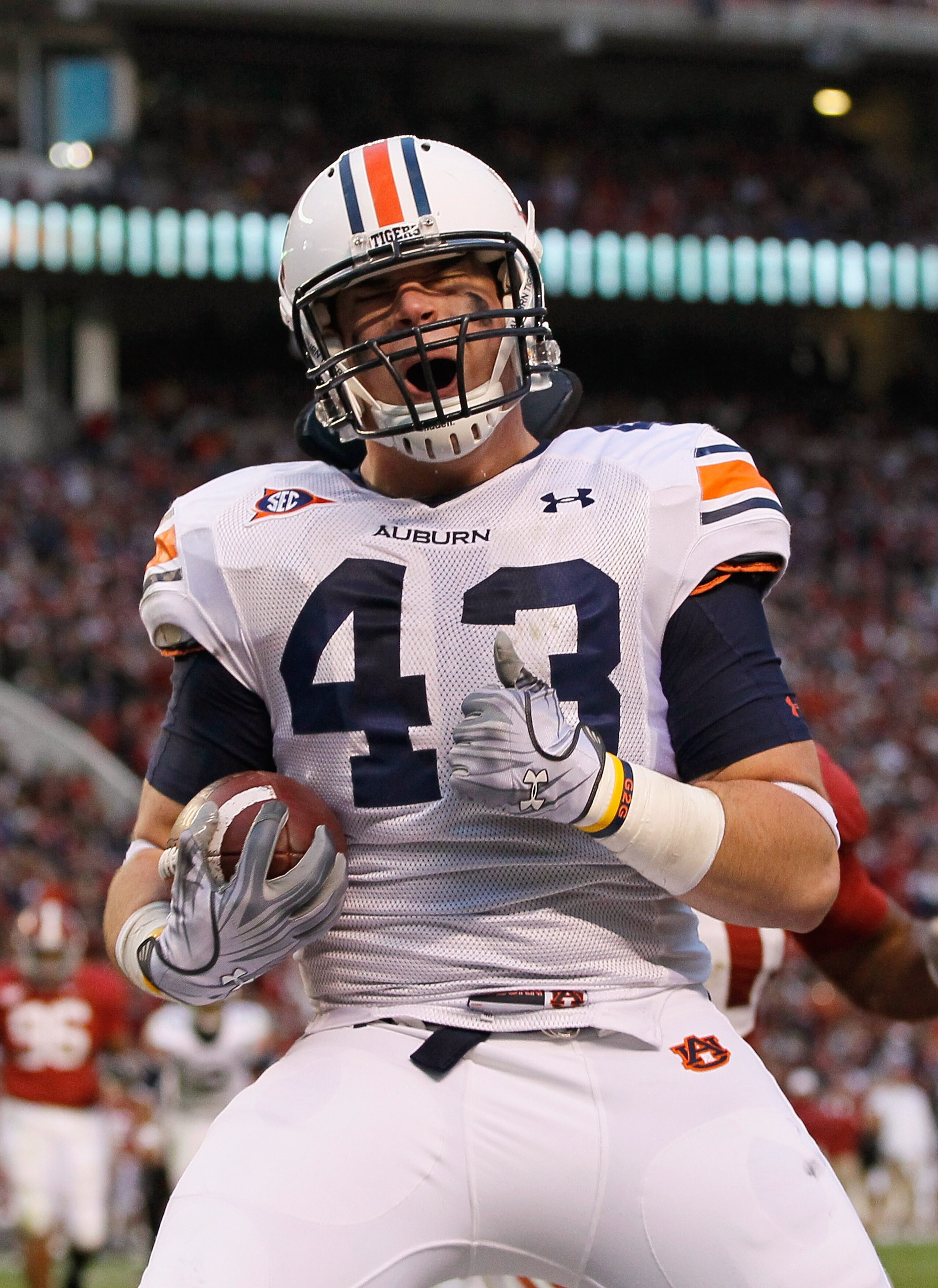 TUSCALOOSA, AL - NOVEMBER 26:  Philip Lutzenkirchen #43 of the Auburn Tigers reacts after pulling in a touchdown reception against the Alabama Crimson Tide at Bryant-Denny Stadium on November 26, 2010 in Tuscaloosa, Alabama.  (Photo by Kevin C. Cox/Getty