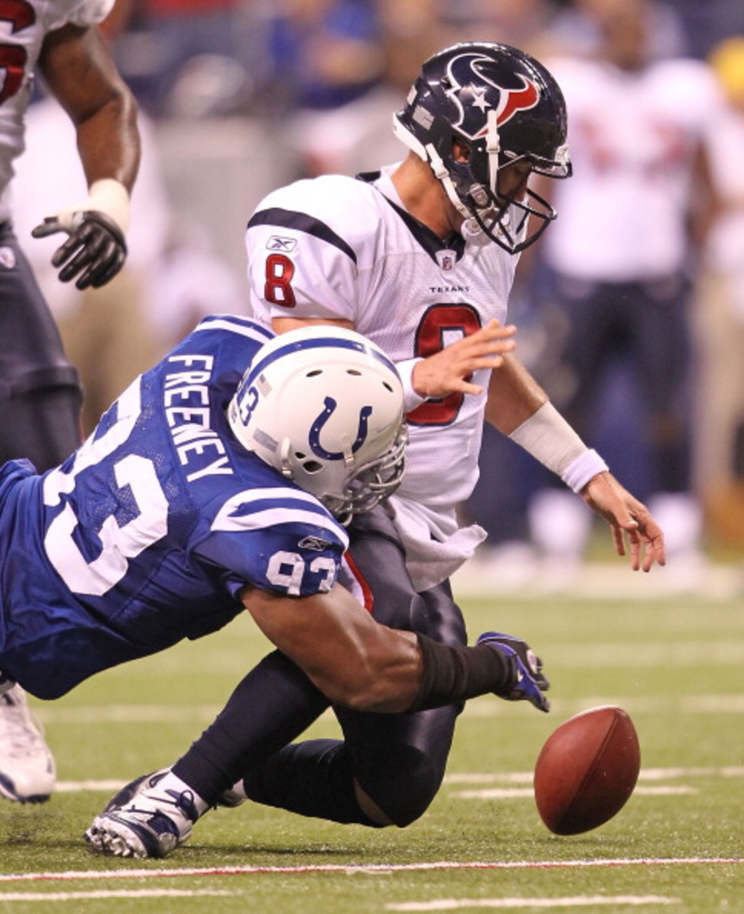 INDIANAPOLIS - NOVEMBER 01:  Matt Schaub #8 of Houston Texans fumbles the ball while being tackled  by Dwight Freeney #93 of the Indianapolis Colts during the NFL game at Lucas Oil Stadium on November 1, 2010 in Indianapolis, Indiana.  (Photo by Andy Lyon
