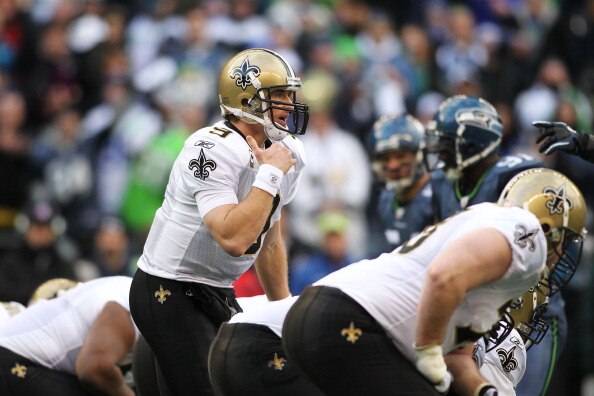 SEATTLE, WA - JANUARY 08:  Drew Brees #9 of the New Orleans Saints calls a play against the Seattle Seahawks during the 2011 NFC wild-card playoff game at Qwest Field on January 8, 2011 in Seattle, Washington.  (Photo by Jonathan Ferrey/Getty Images)