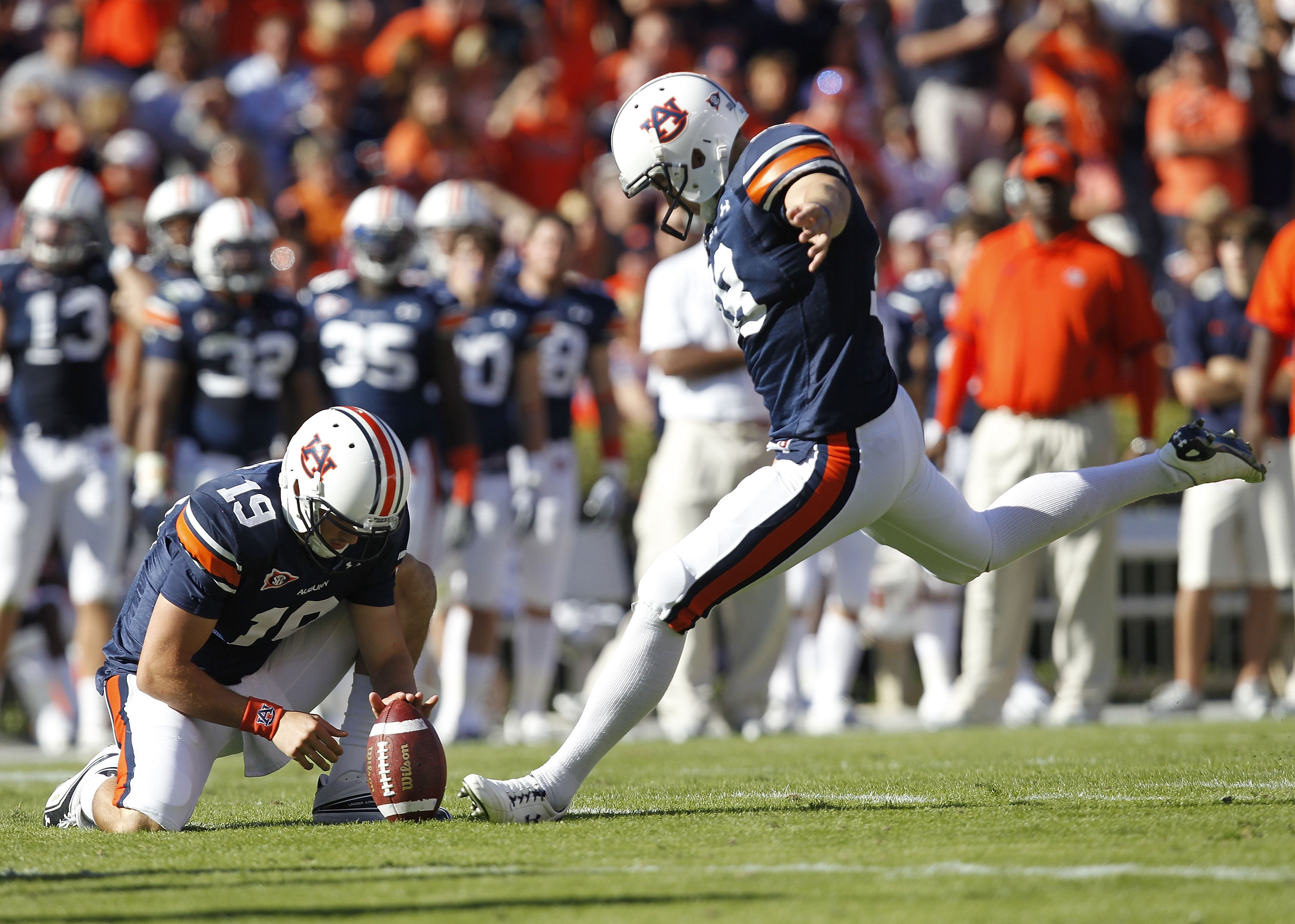 AUBURN - OCTOBER 16:  Field goal kicker Wes Byrum #18 of the Auburn Tigers prepares to kick a field goal in the second quarter while Neil Caudle #19 holds the ball during the game against the Arkansas Razorbacks at Jordan-Hare Stadium on October 16, 2010