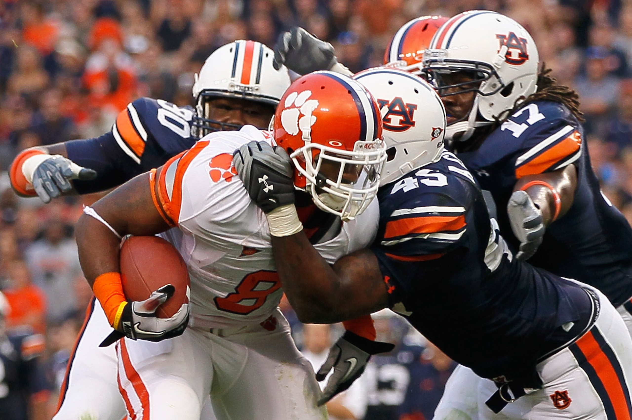 AUBURN, AL - SEPTEMBER 18:  Jamie Harper #8 of the Clemson Tigers is tackled by Nick Fairley #90, Antoine Carter #45 and Josh Bynes #17 of the Auburn Tigers at Jordan-Hare Stadium on September 18, 2010 in Auburn, Alabama.  (Photo by Kevin C. Cox/Getty Ima