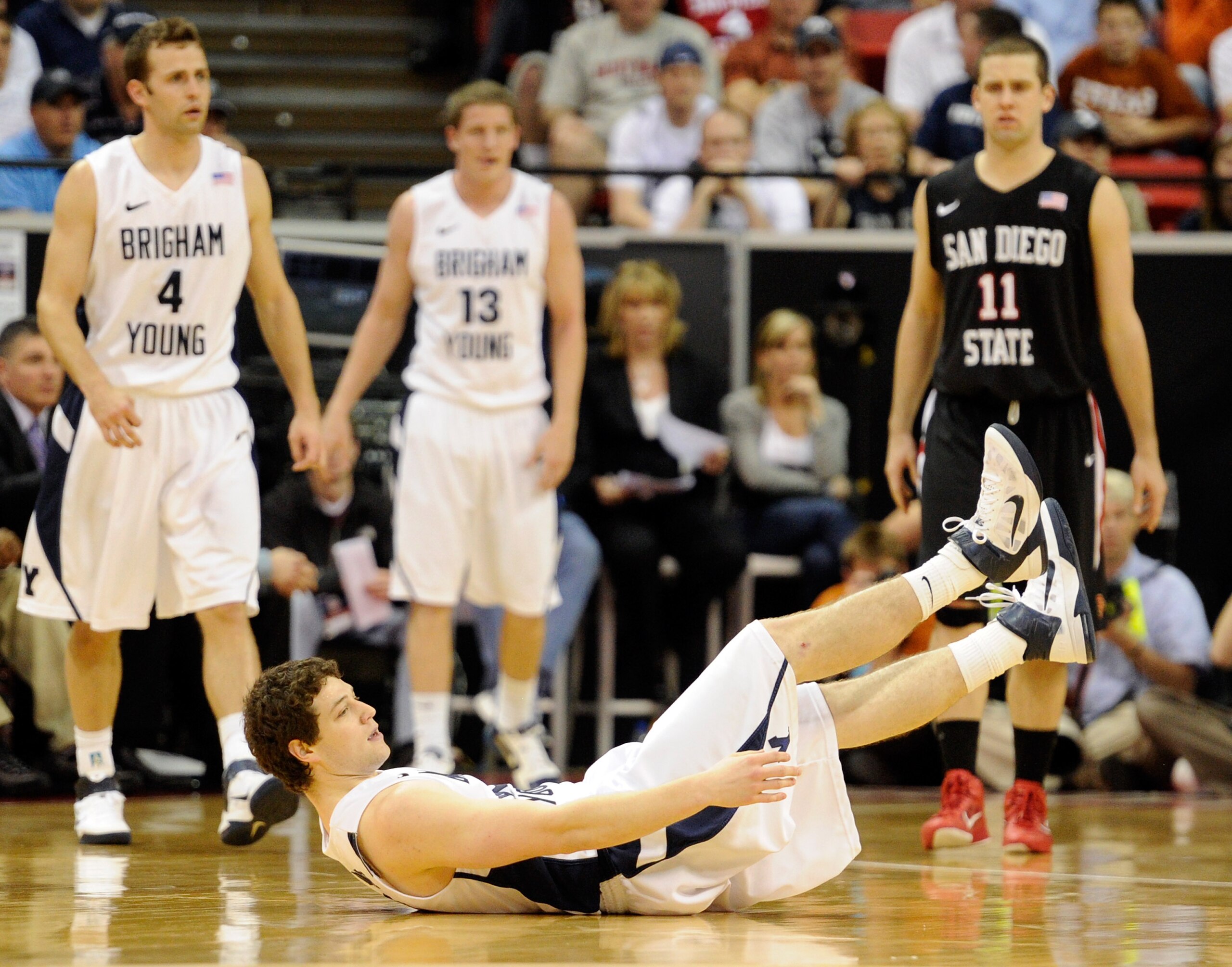 LAS VEGAS, NV - MARCH 12: Jimmer Fredette #32 of the Brigham Young University Cougars falls to the court after being fouled during BYU's 72-54 loss to the San Diego State Aztecs in the championship game of the Conoco Mountain West Conference Basketball t LAS VEGAS, NV - MARCH 12: Jimmer Fredette #32 of the Brigham Young University Cougars falls to the court after being fouled during BYU's 72-54 loss to the San Diego State Aztecs in the championship game of the Conoco Mountain West Conference Basketball t