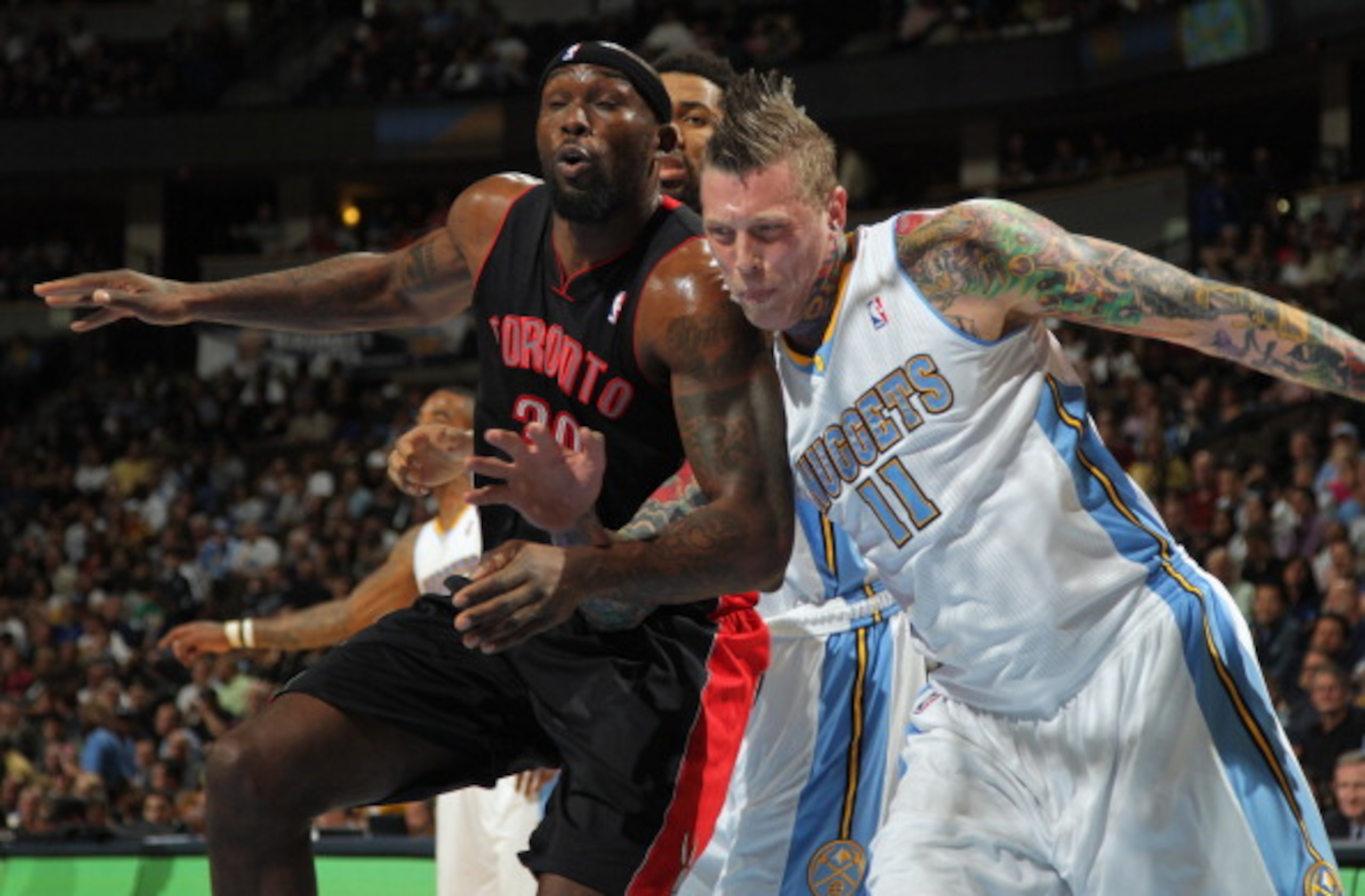 DENVER, CO - MARCH 21: Chris Andersen #11 of the Denver Nuggets battles for position with Reggie Evans #30 of the Toronto Raptors at the Pepsi Center on March 21, 2011 in Denver, Colorado. NOTE TO USER: User expressly acknowledges and agrees that, by dow DENVER, CO - MARCH 21: Chris Andersen #11 of the Denver Nuggets battles for position with Reggie Evans #30 of the Toronto Raptors at the Pepsi Center on March 21, 2011 in Denver, Colorado. NOTE TO USER: User expressly acknowledges and agrees that, by dow