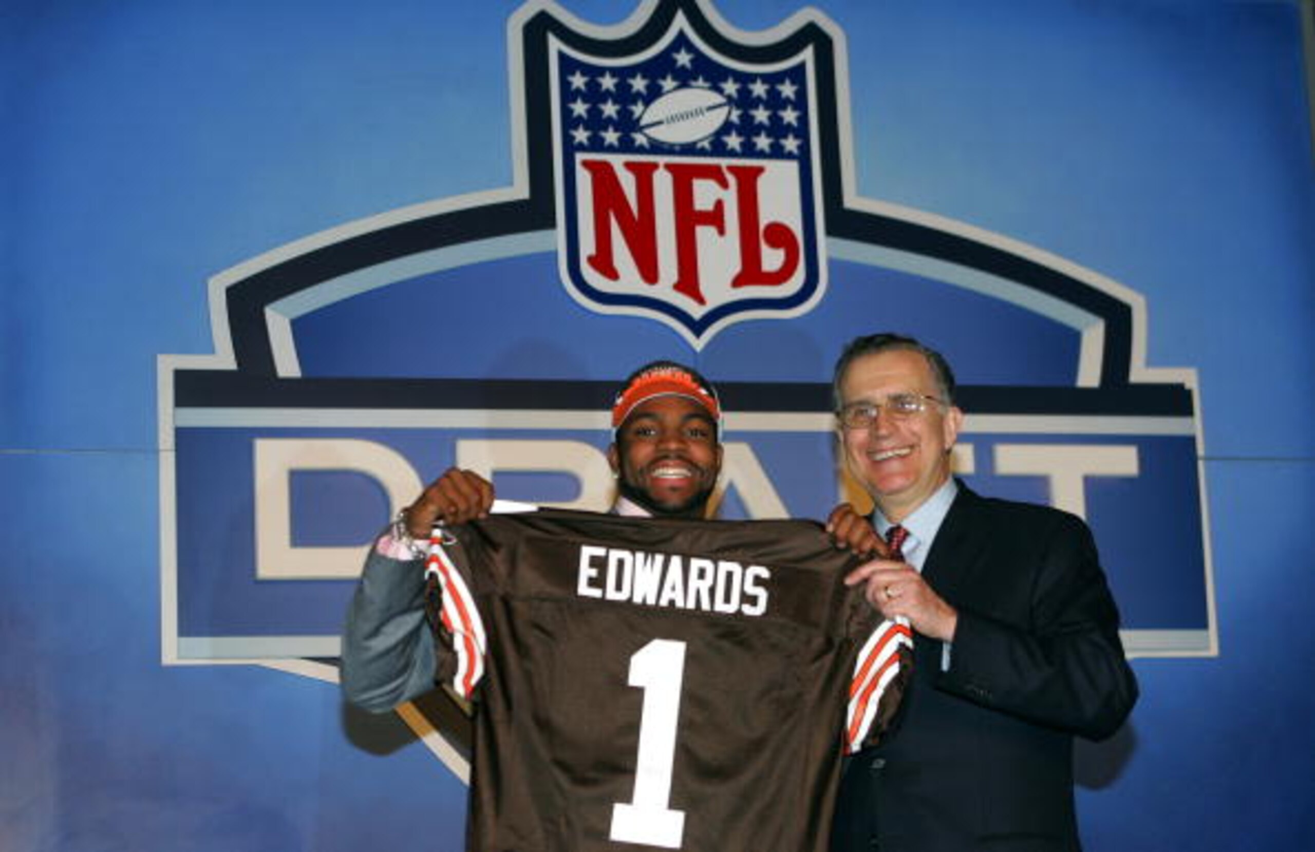 NEW YORK CITY - APRIL 23: Wide Receiver Braylon Edwards (Michigan) poses with NFL Commissioner Paul Tagliabue after Edwards was drafted third overall by the Cleveland Browns during the 70th NFL Draft on April 23, 2005 at the Jacob K. Javits Convention Ce NEW YORK CITY - APRIL 23: Wide Receiver Braylon Edwards (Michigan) poses with NFL Commissioner Paul Tagliabue after Edwards was drafted third overall by the Cleveland Browns during the 70th NFL Draft on April 23, 2005 at the Jacob K. Javits Convention Ce